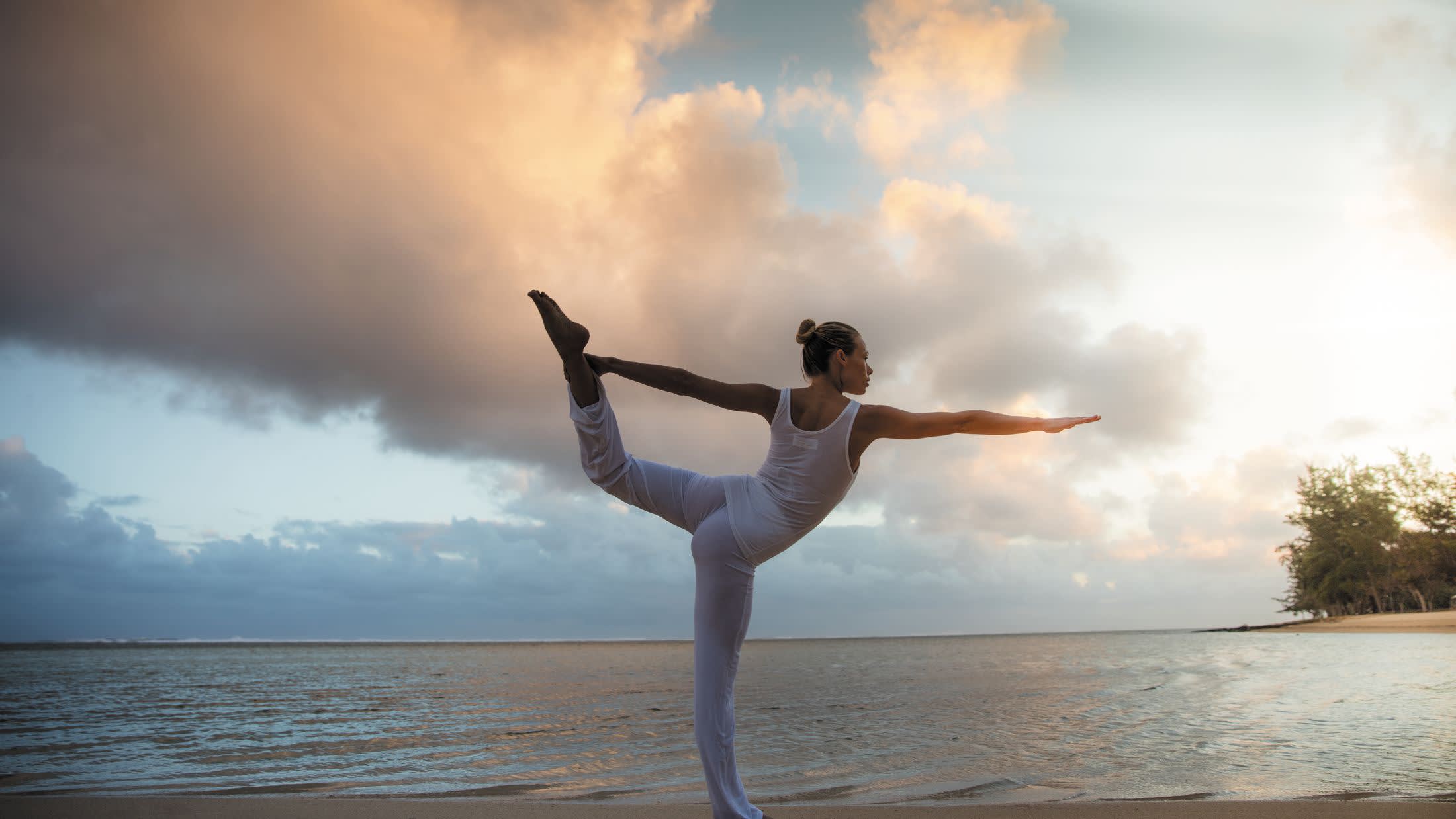 a man standing in front of a body of water