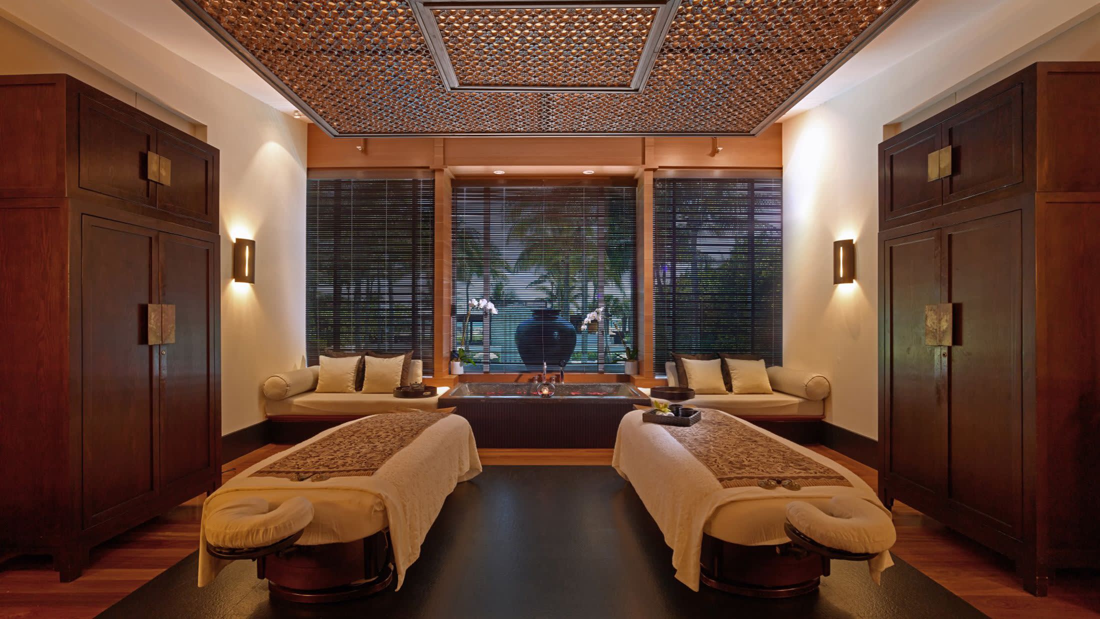 a living room filled with furniture and a large window