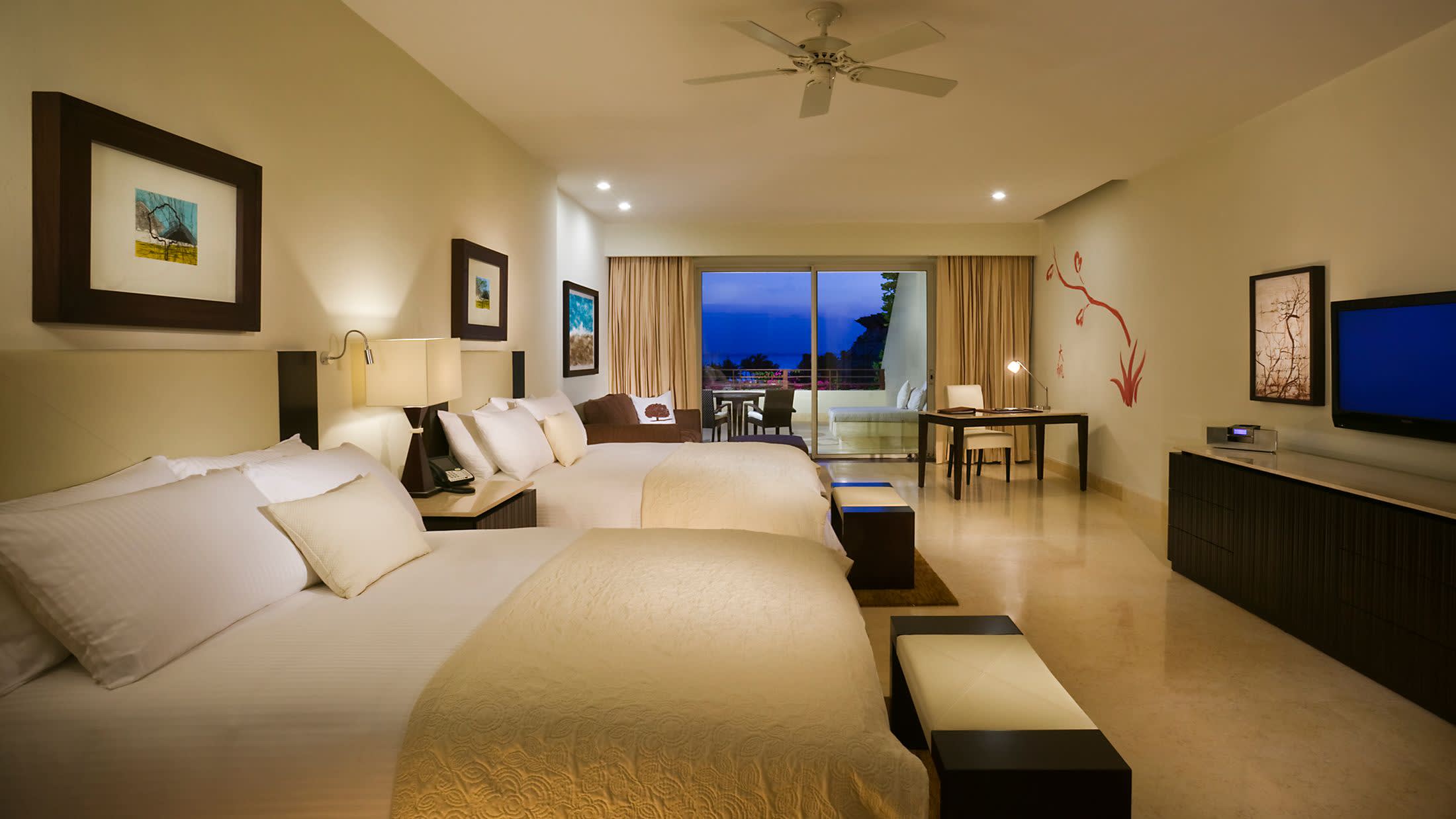 a bedroom with a large bed in a hotel room