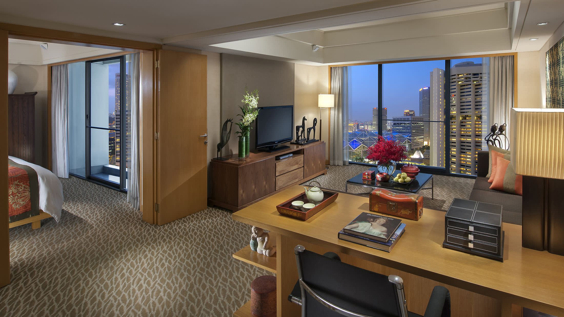 a living room filled with furniture and a large window