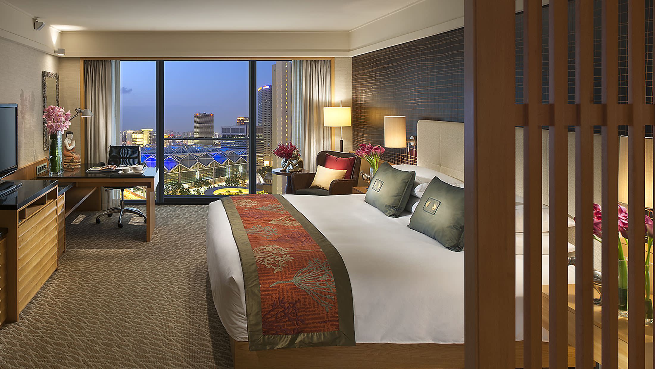 a view of a living room filled with furniture and a large window