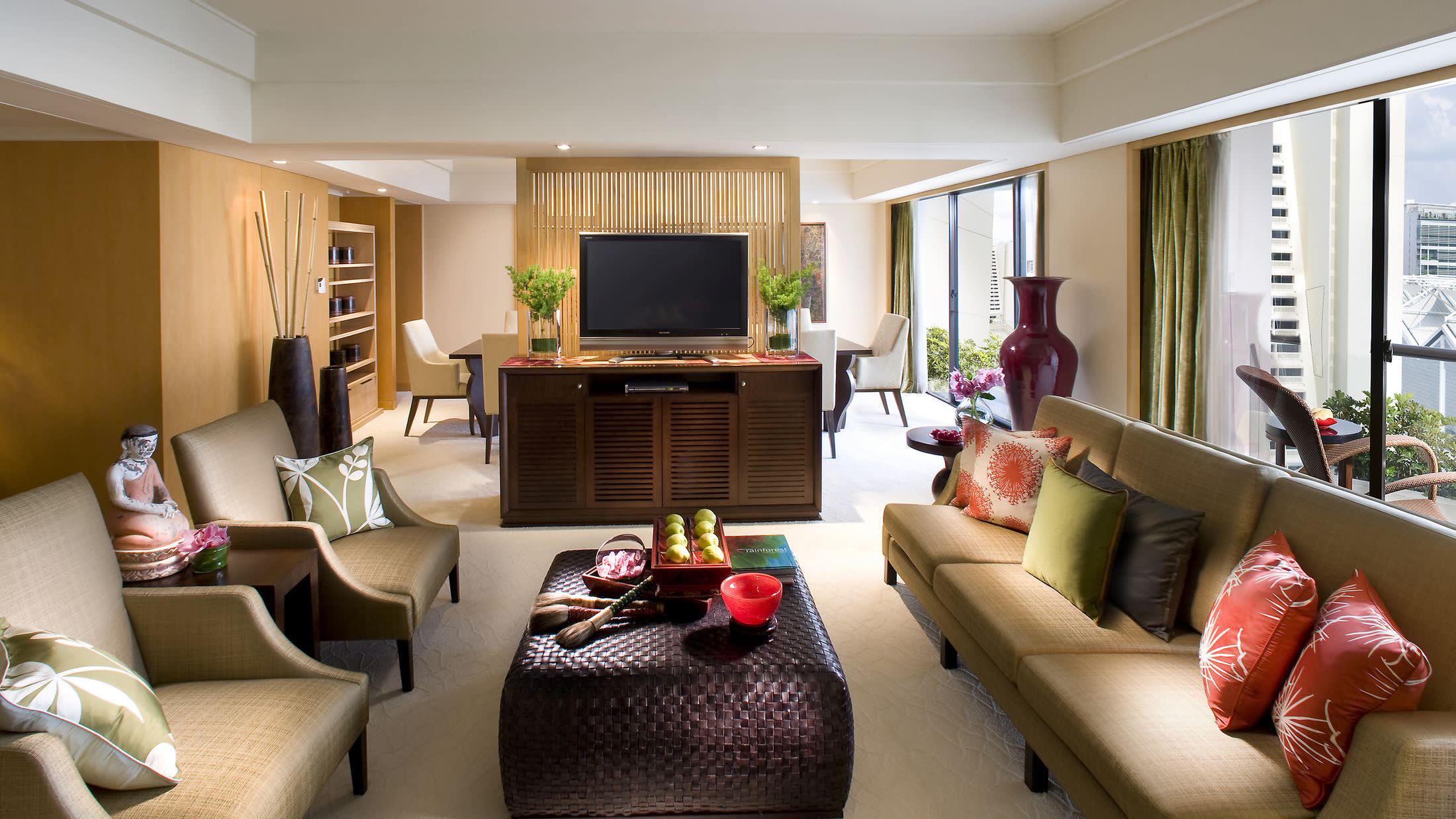 a living room filled with furniture and a flat screen tv