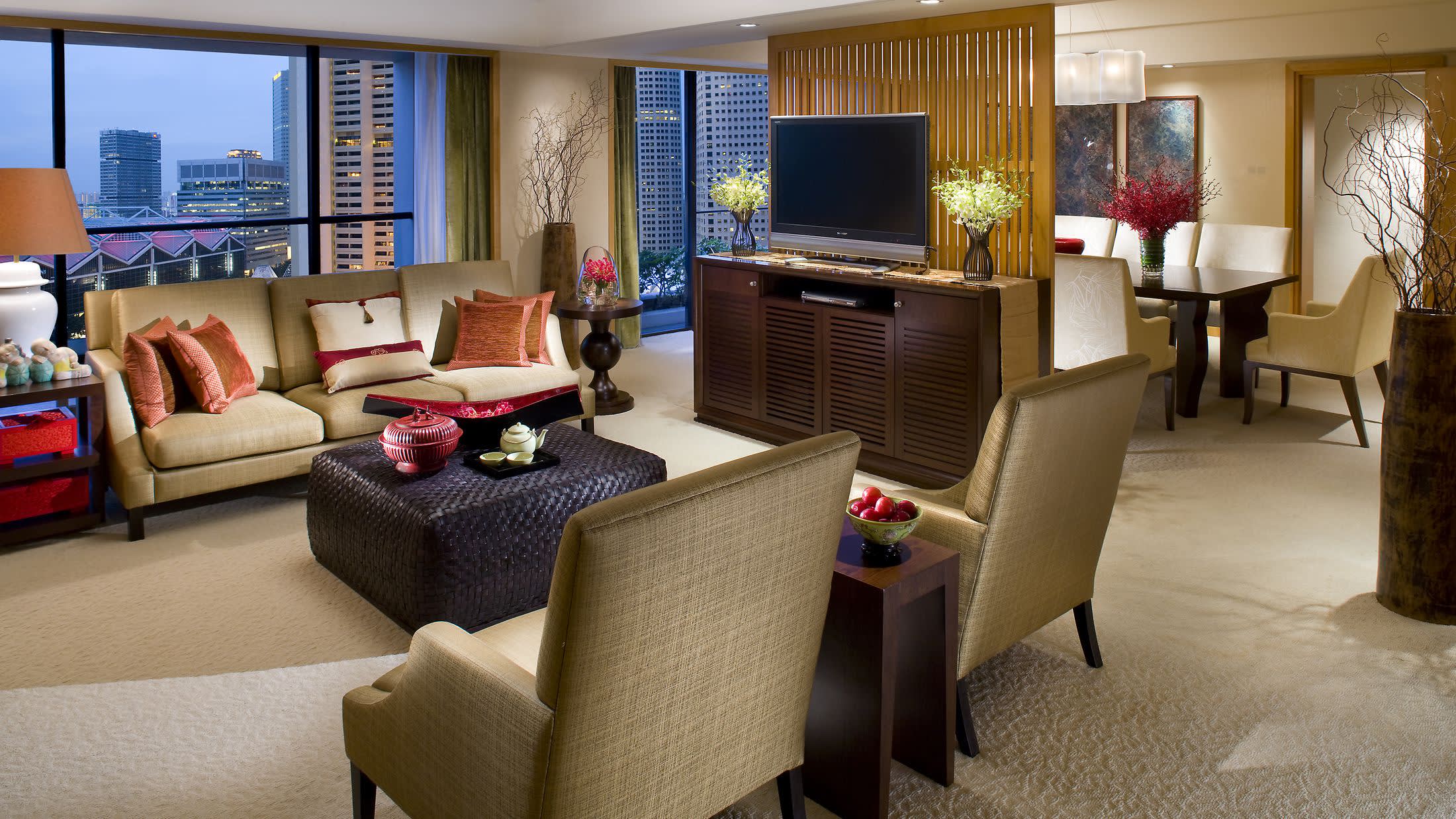 a view of a living room filled with furniture and a flat screen tv