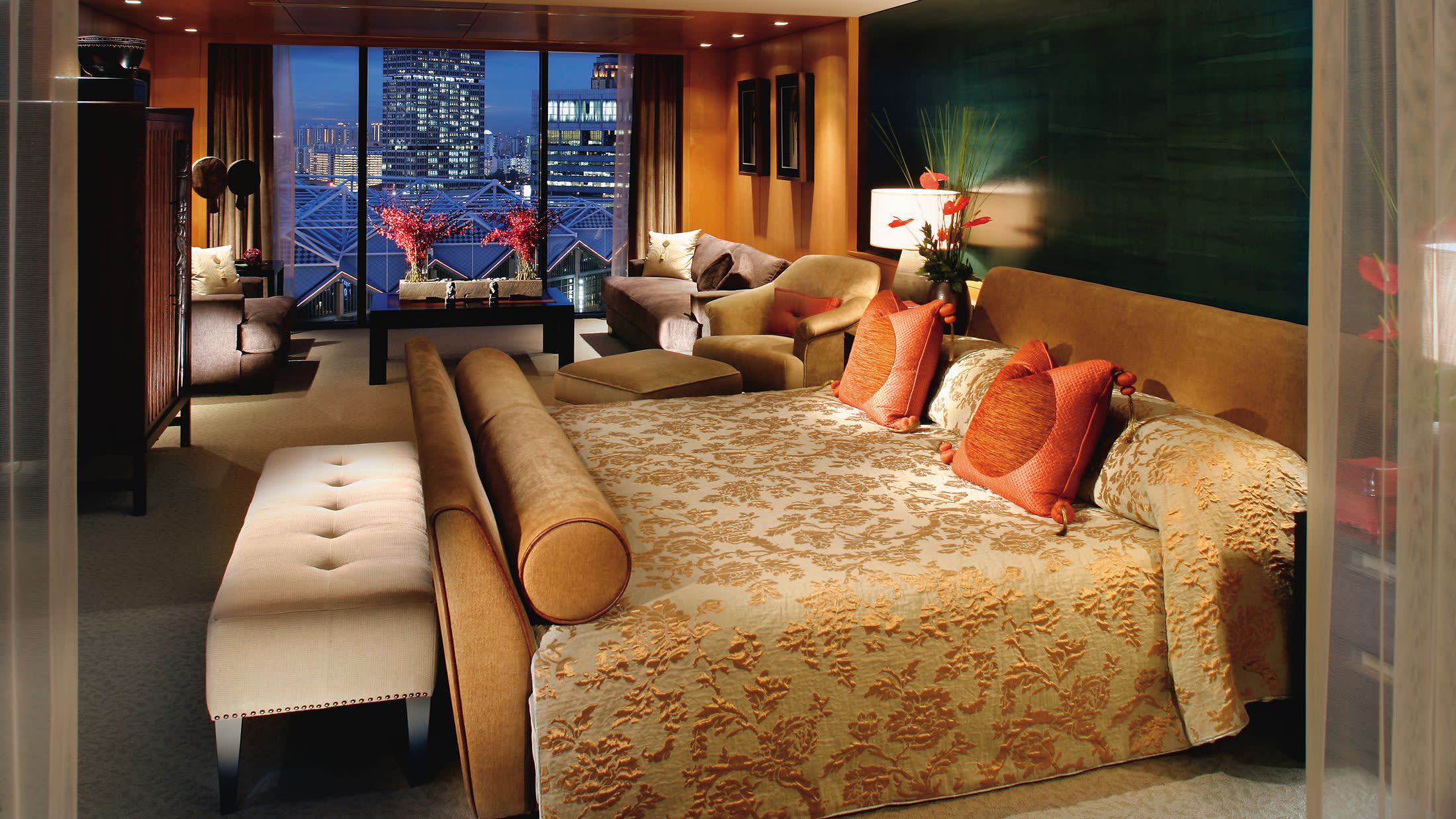 a view of a living room filled with furniture and a large window