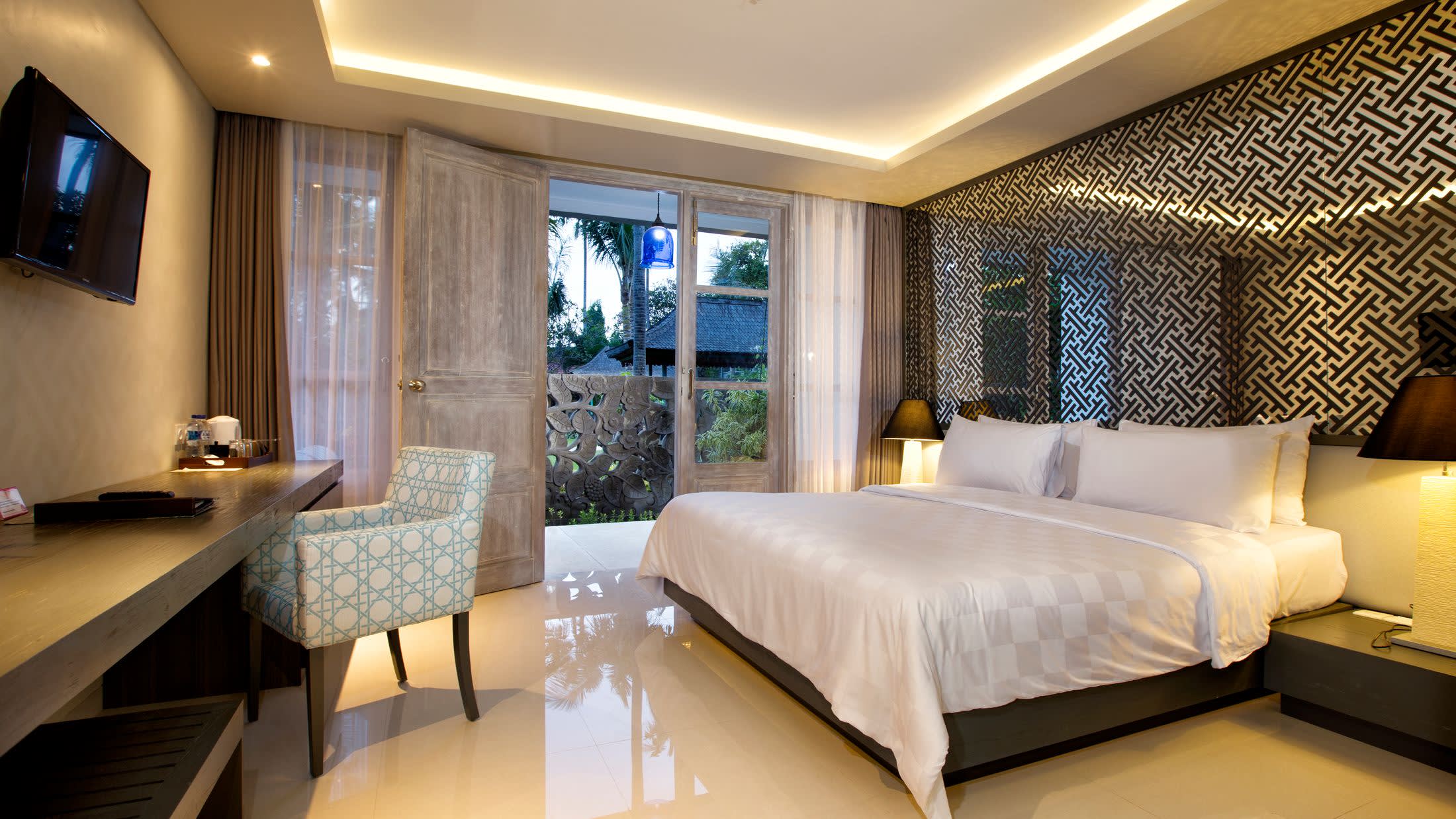 a bedroom with a large bed in a room