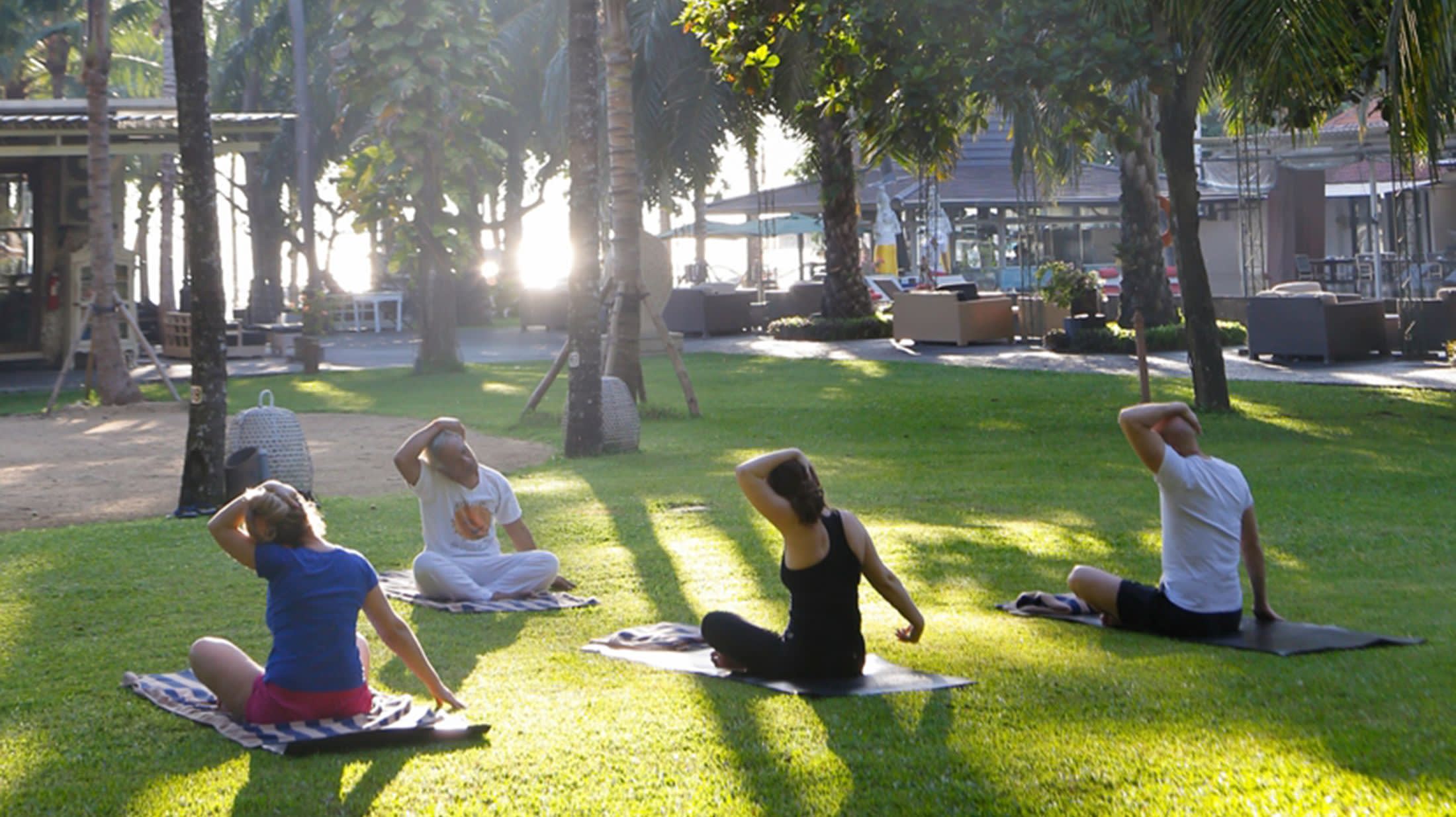 a person sitting on a bench in a park