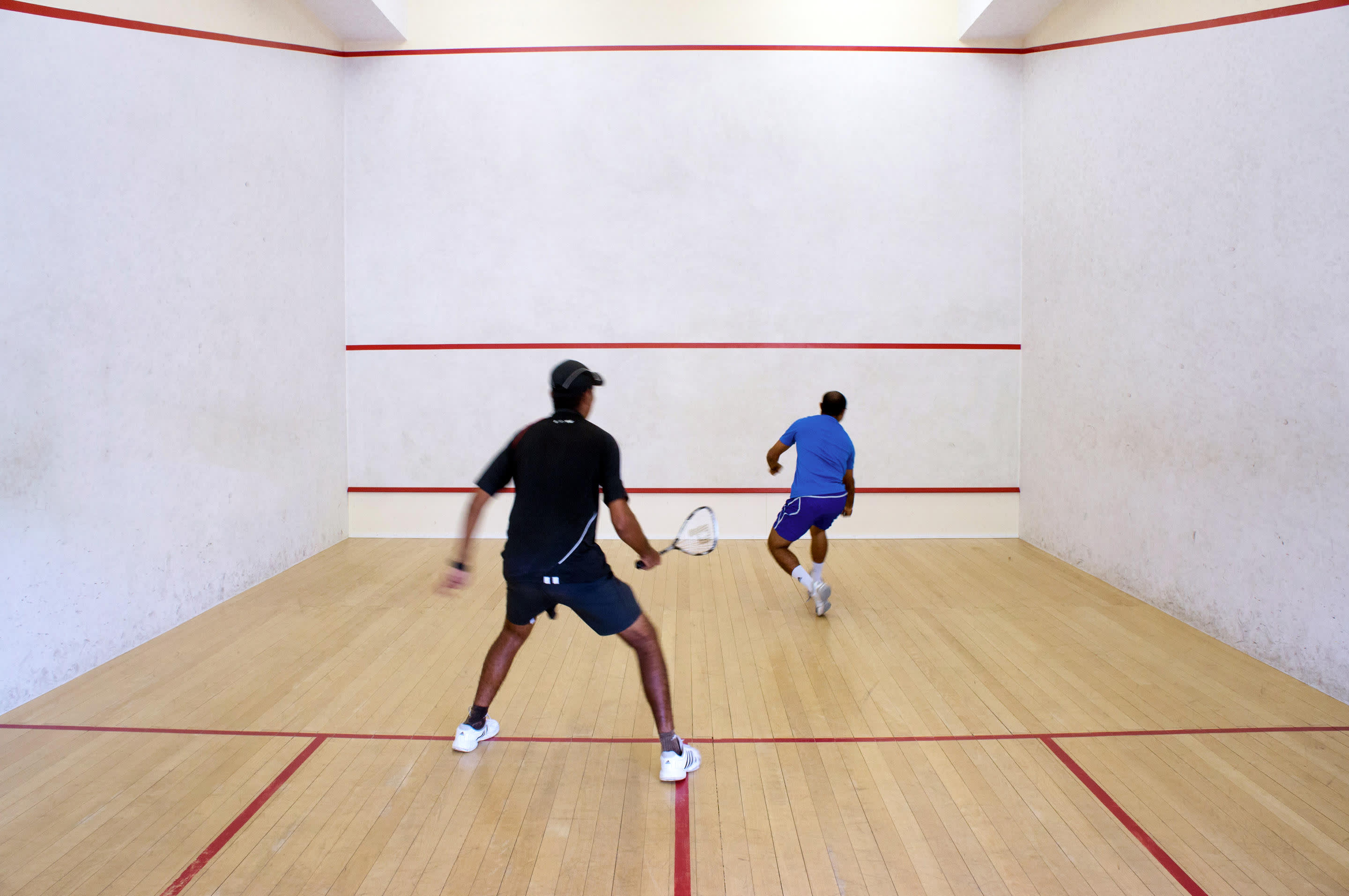 a person on a court with a racquet