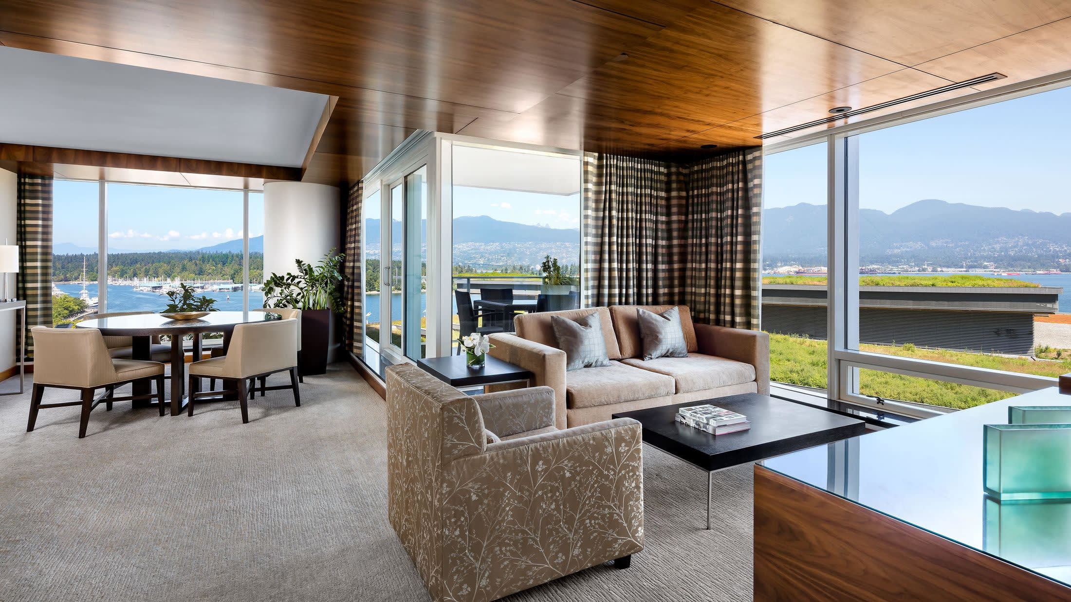 a view of a living room filled with furniture and a large window