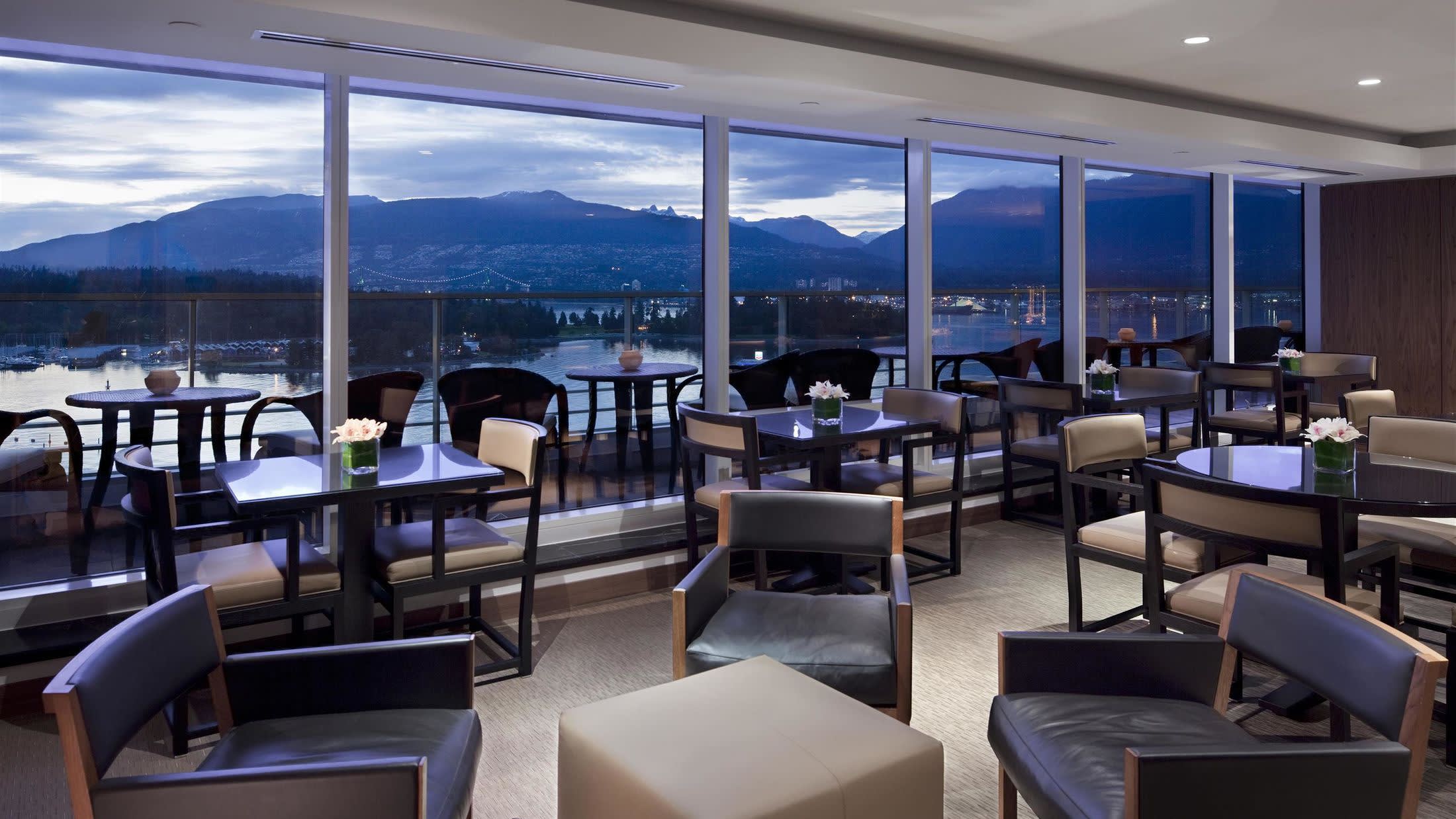 a room filled with furniture and a large window