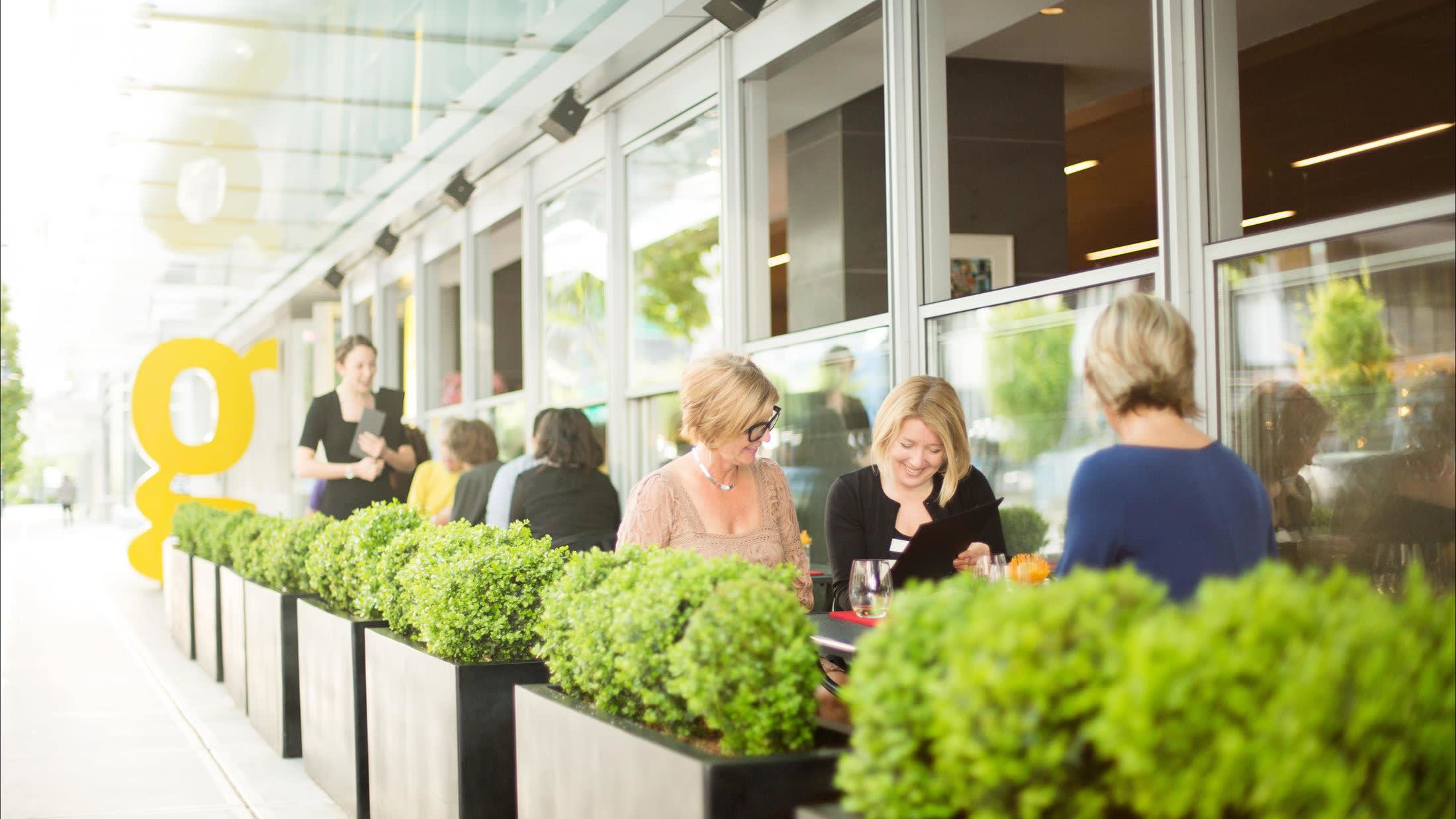 a group of people standing in a garden