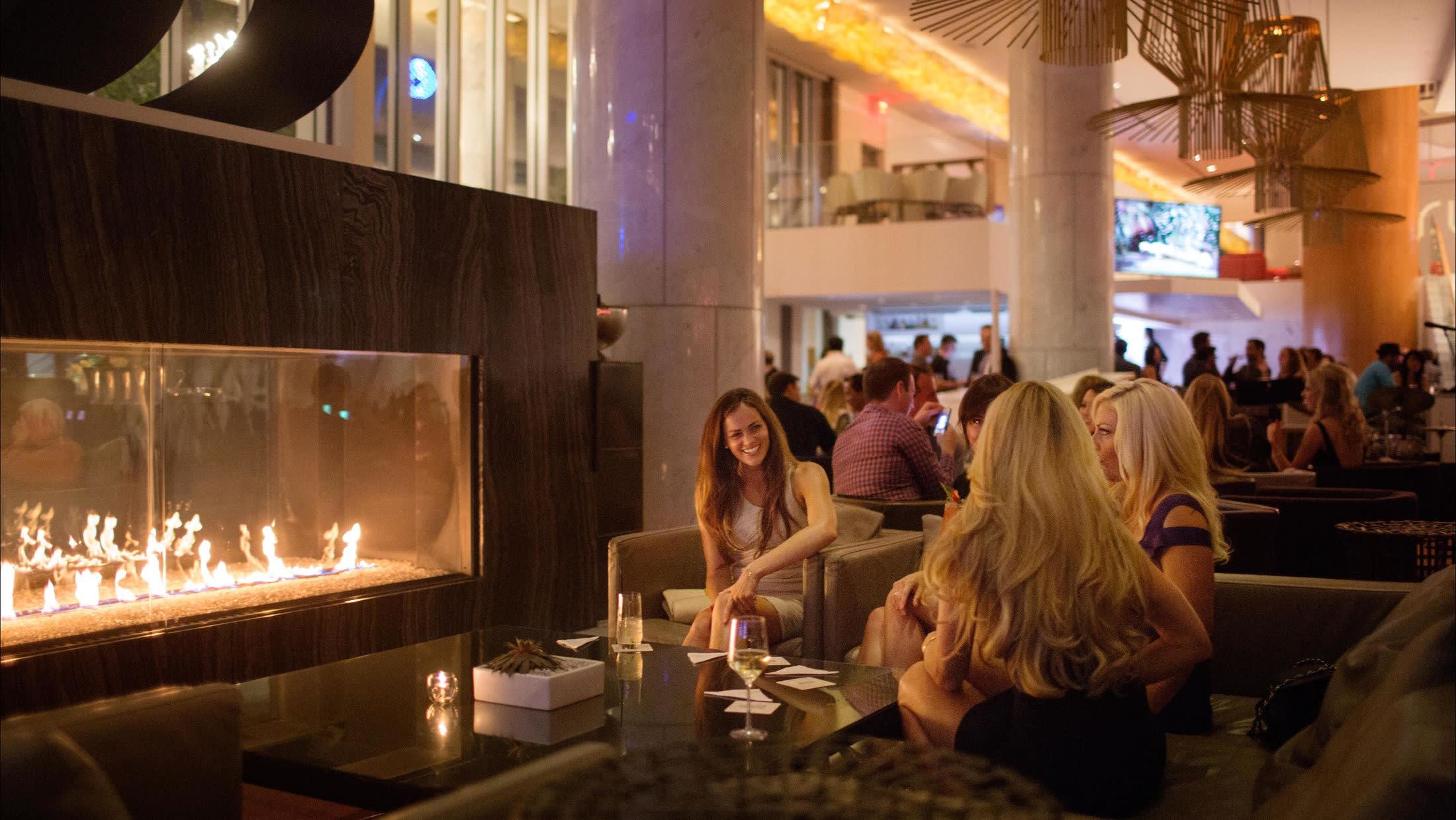 a person standing in front of a fireplace