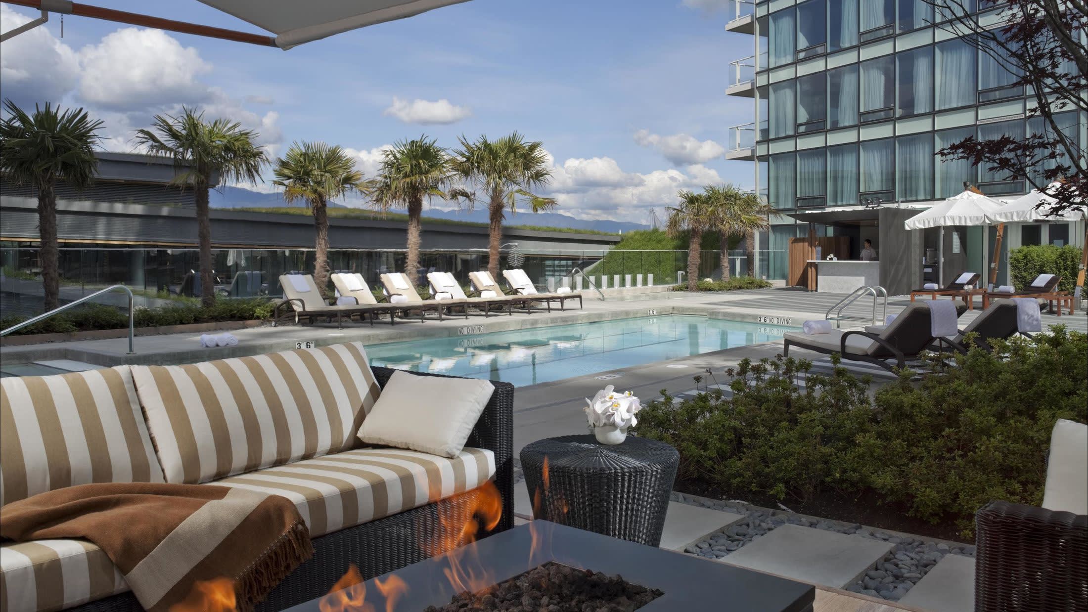 a room with a couch a table and chairs