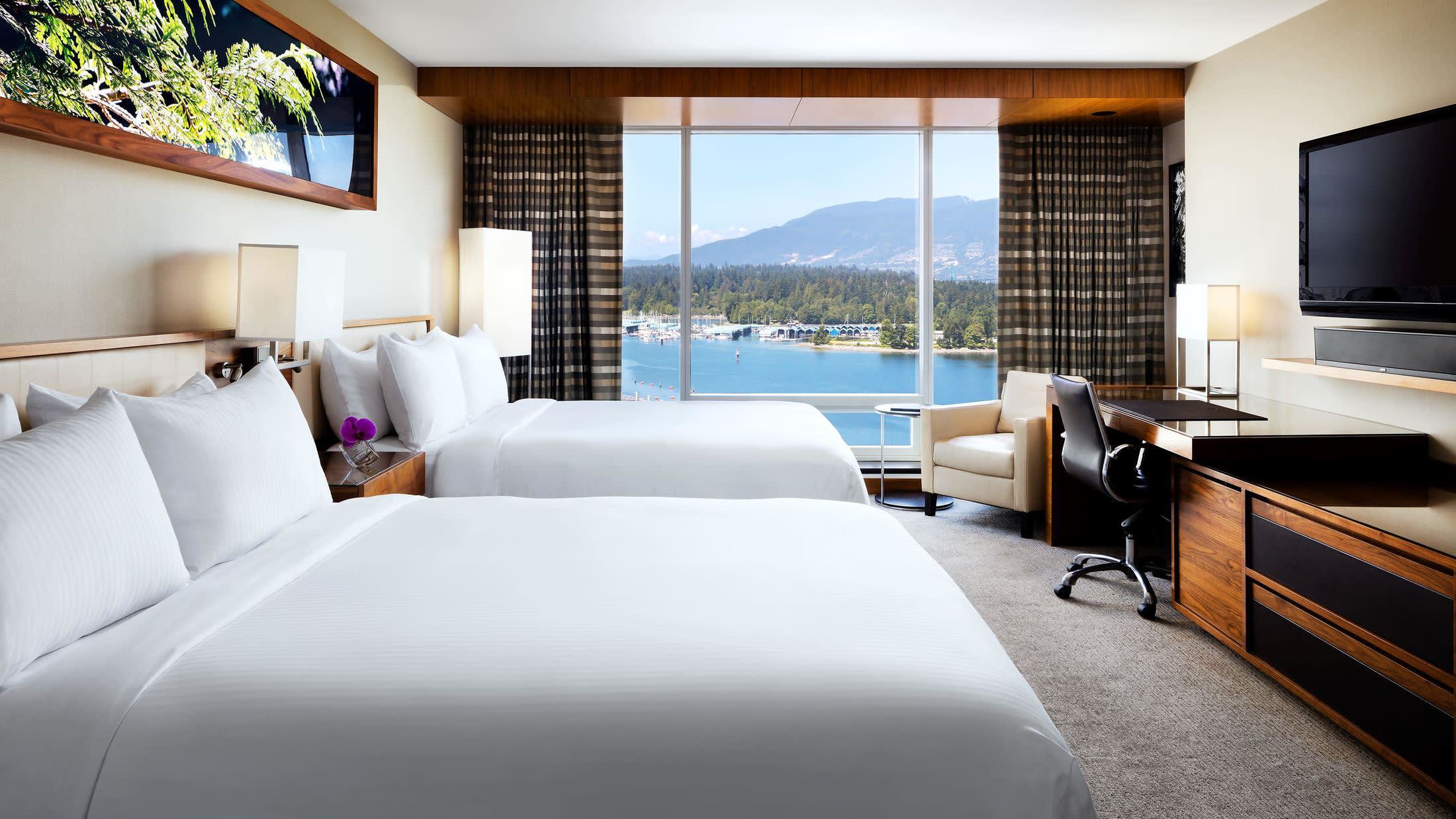 a bedroom with a large bed in a hotel room