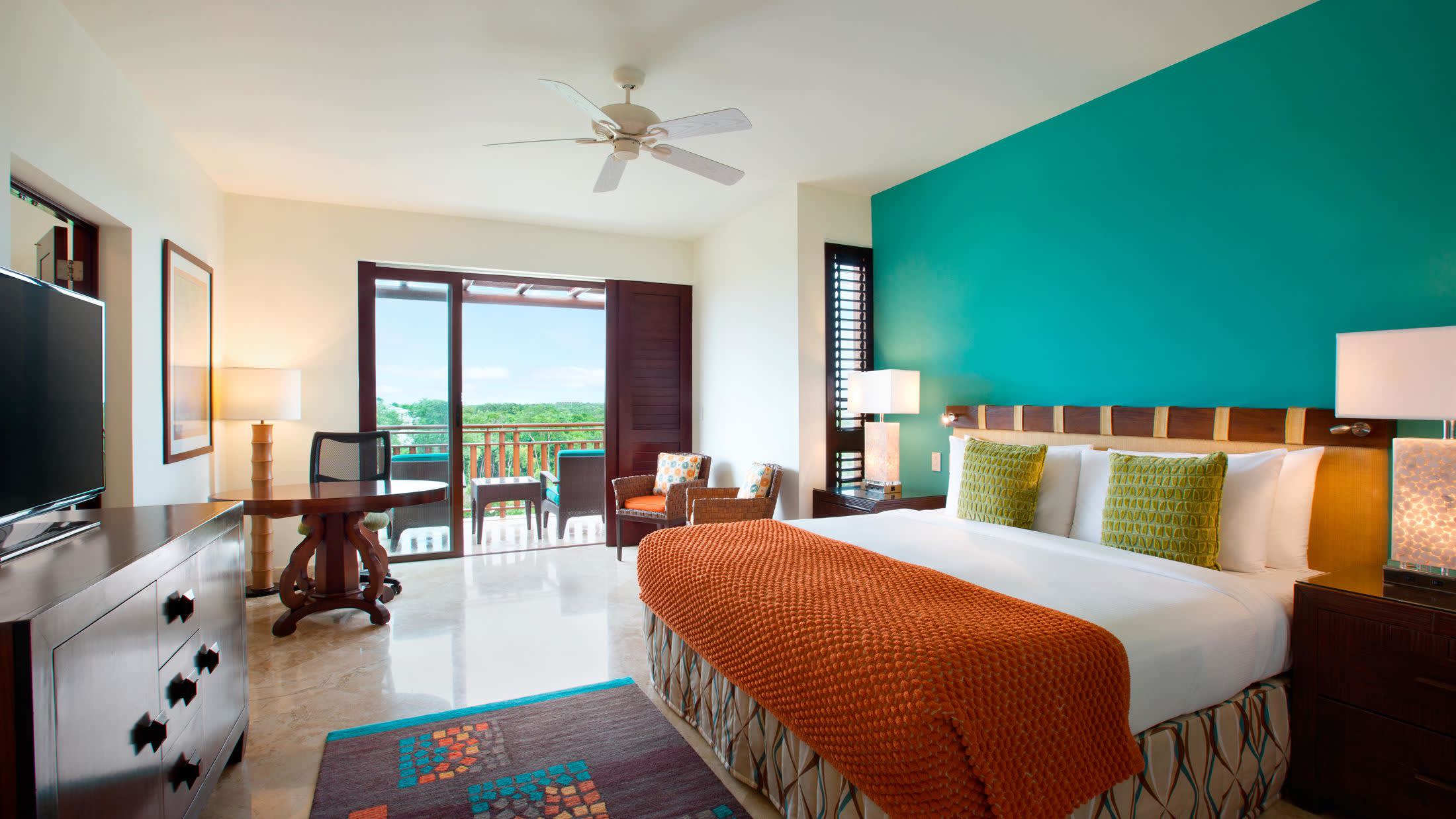 a bedroom with a large bed in a hotel room