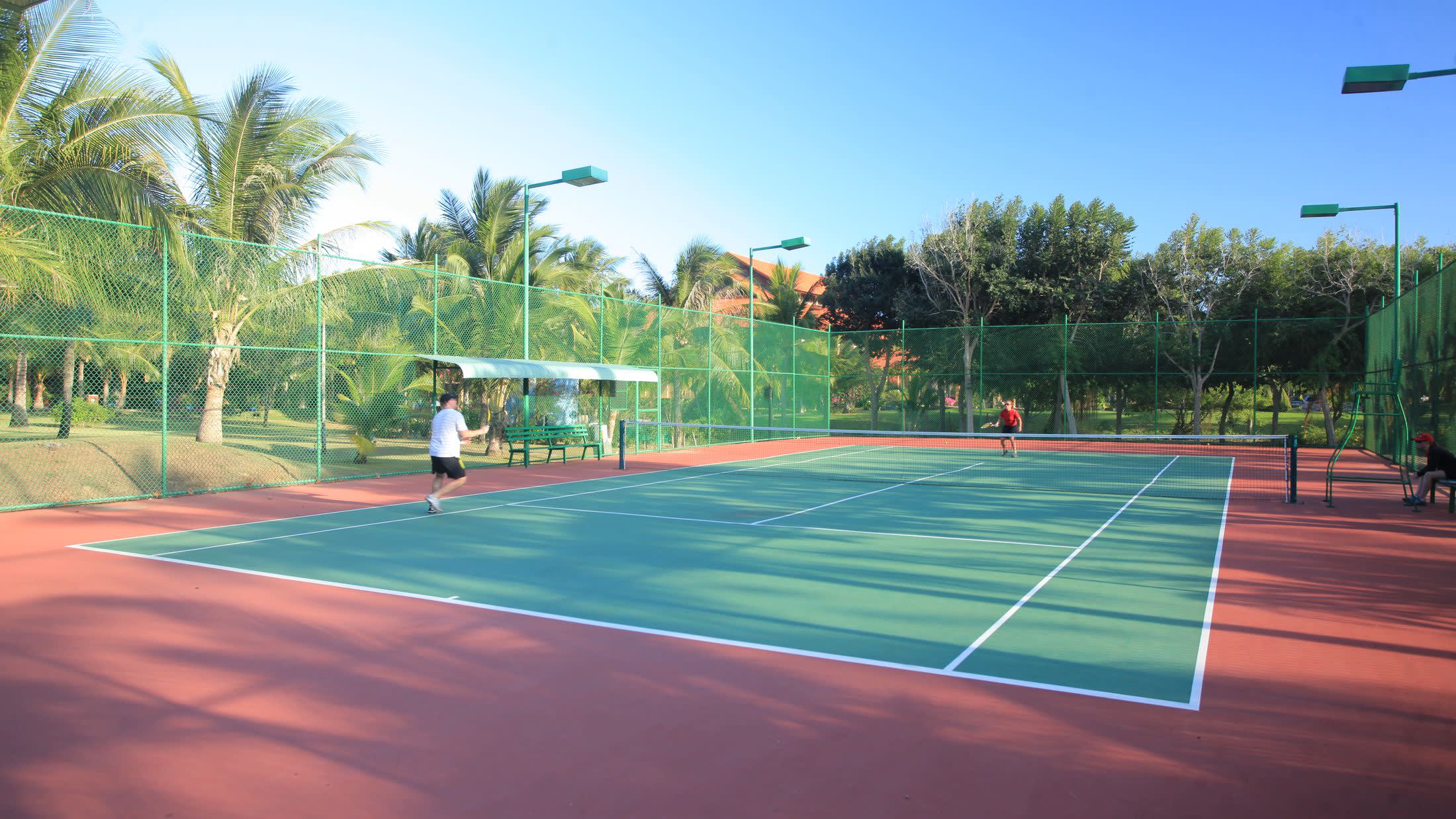 a person on a court with a racket