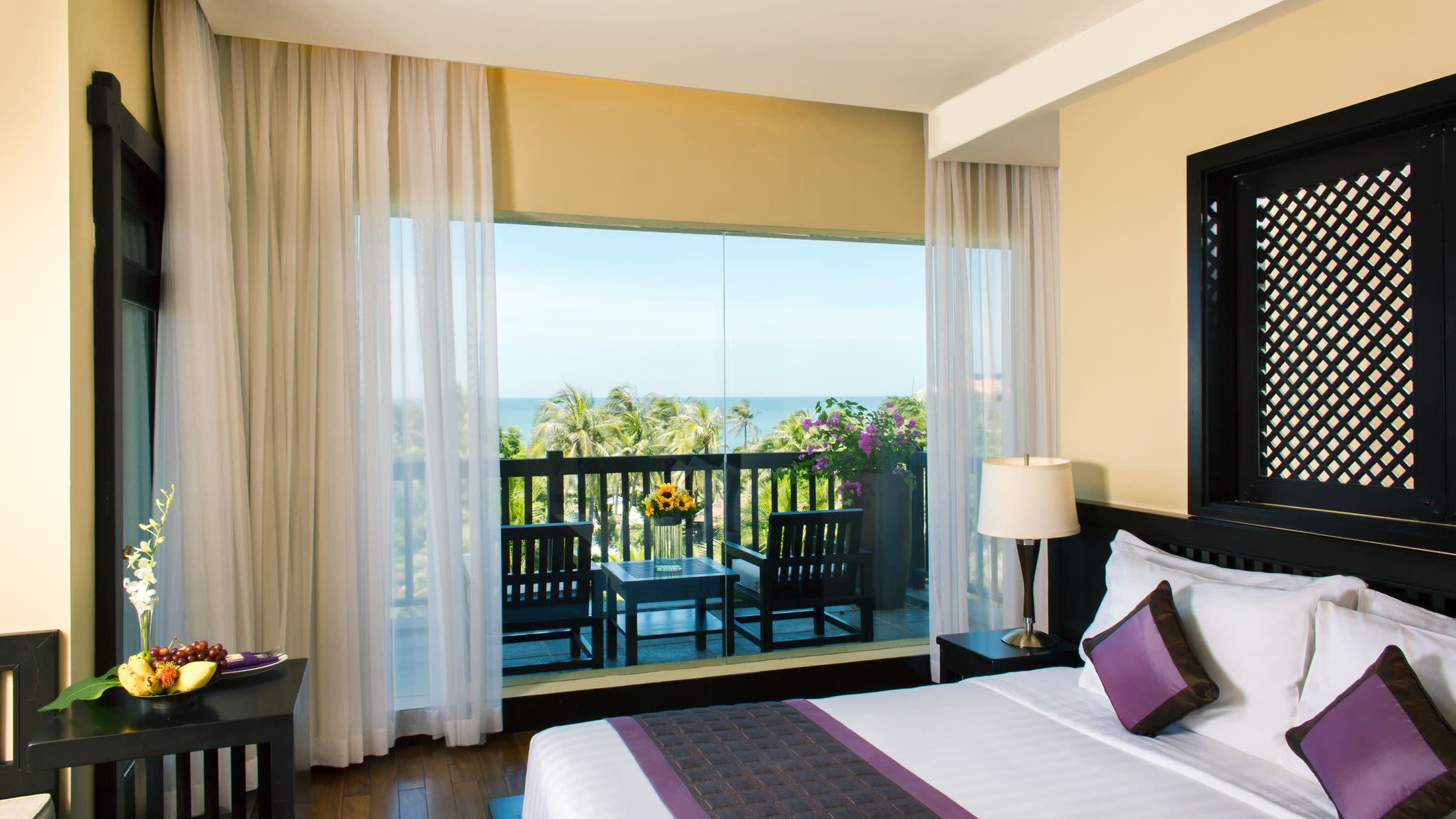 a living room filled with furniture and a large window