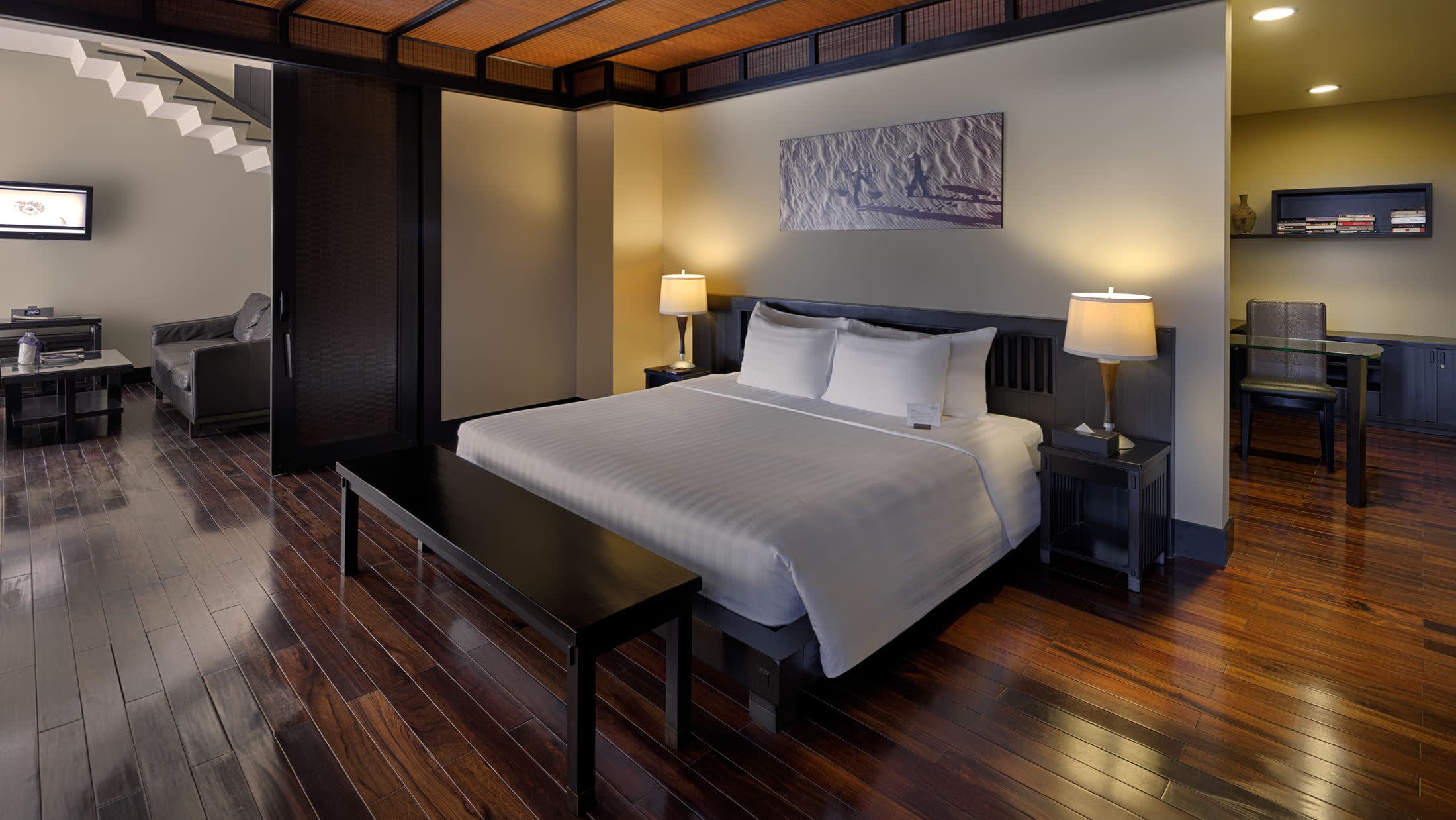 a living room filled with furniture and a flat screen tv