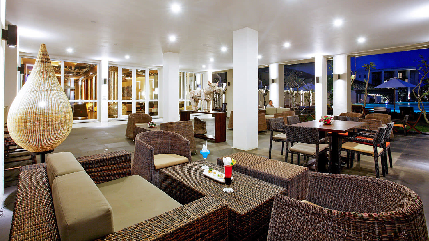 a living room filled with furniture and a large window