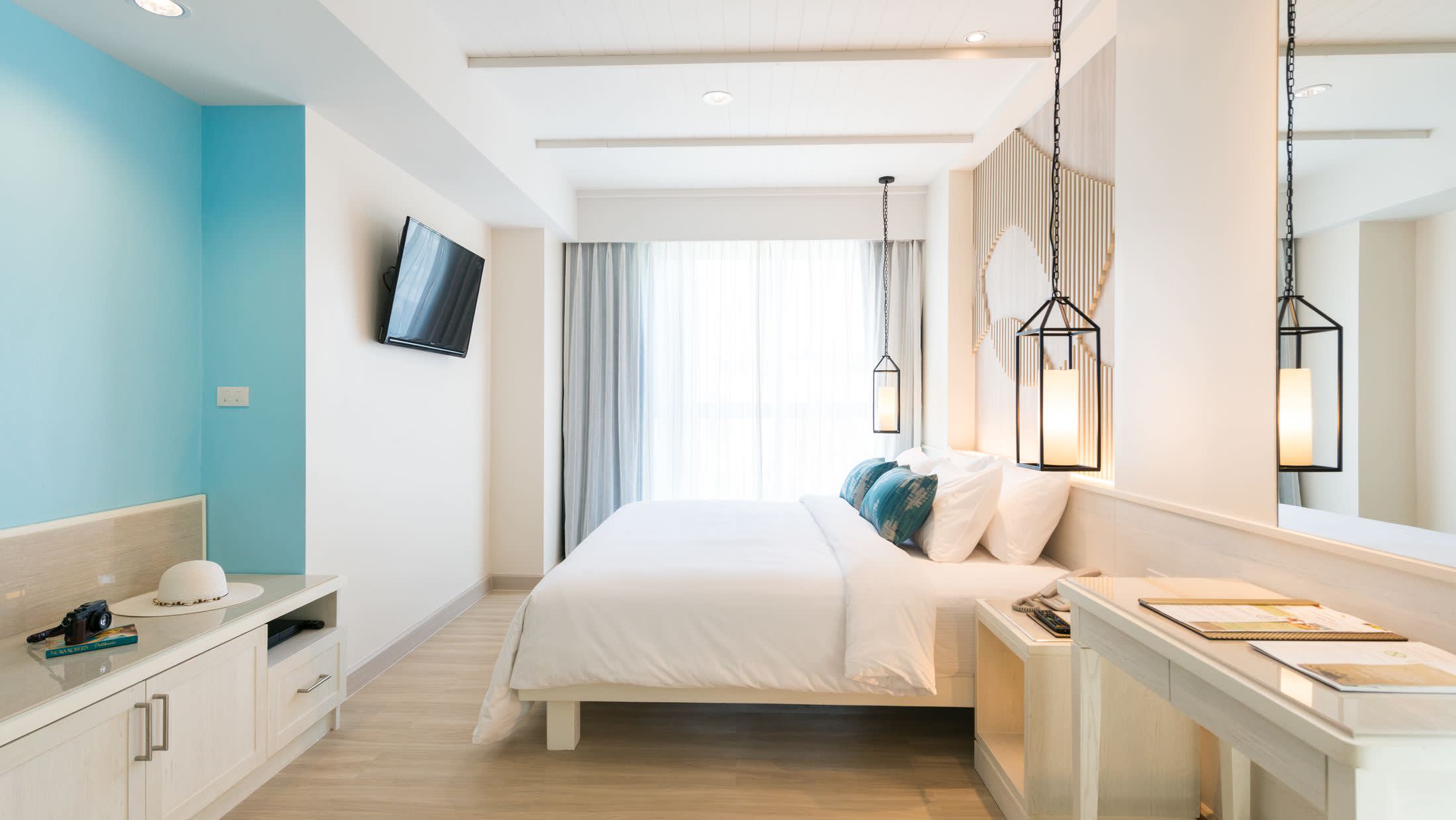 a bedroom with a bed in a room