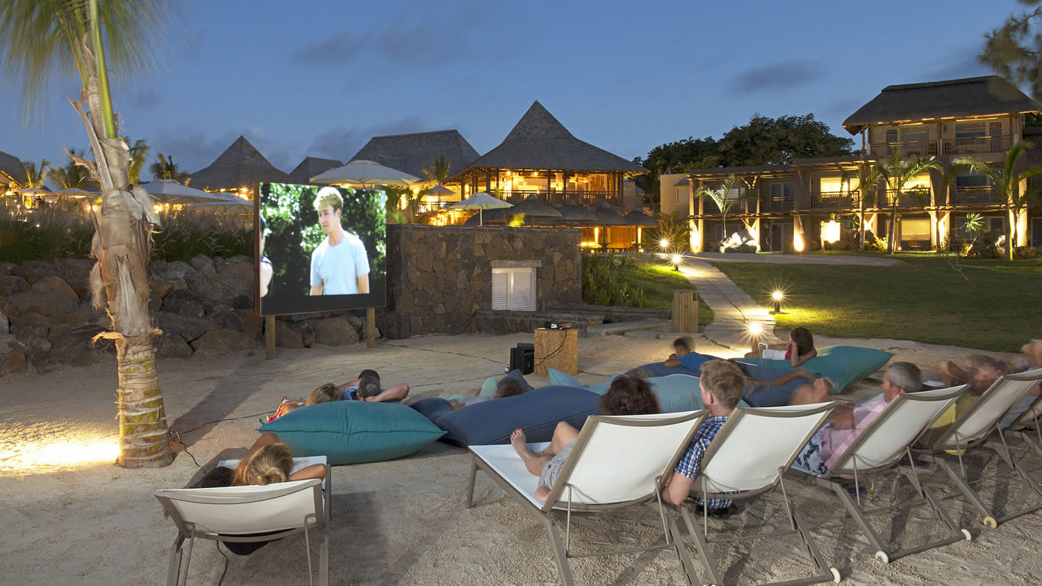 a group of lawn chairs sitting on top of a beach