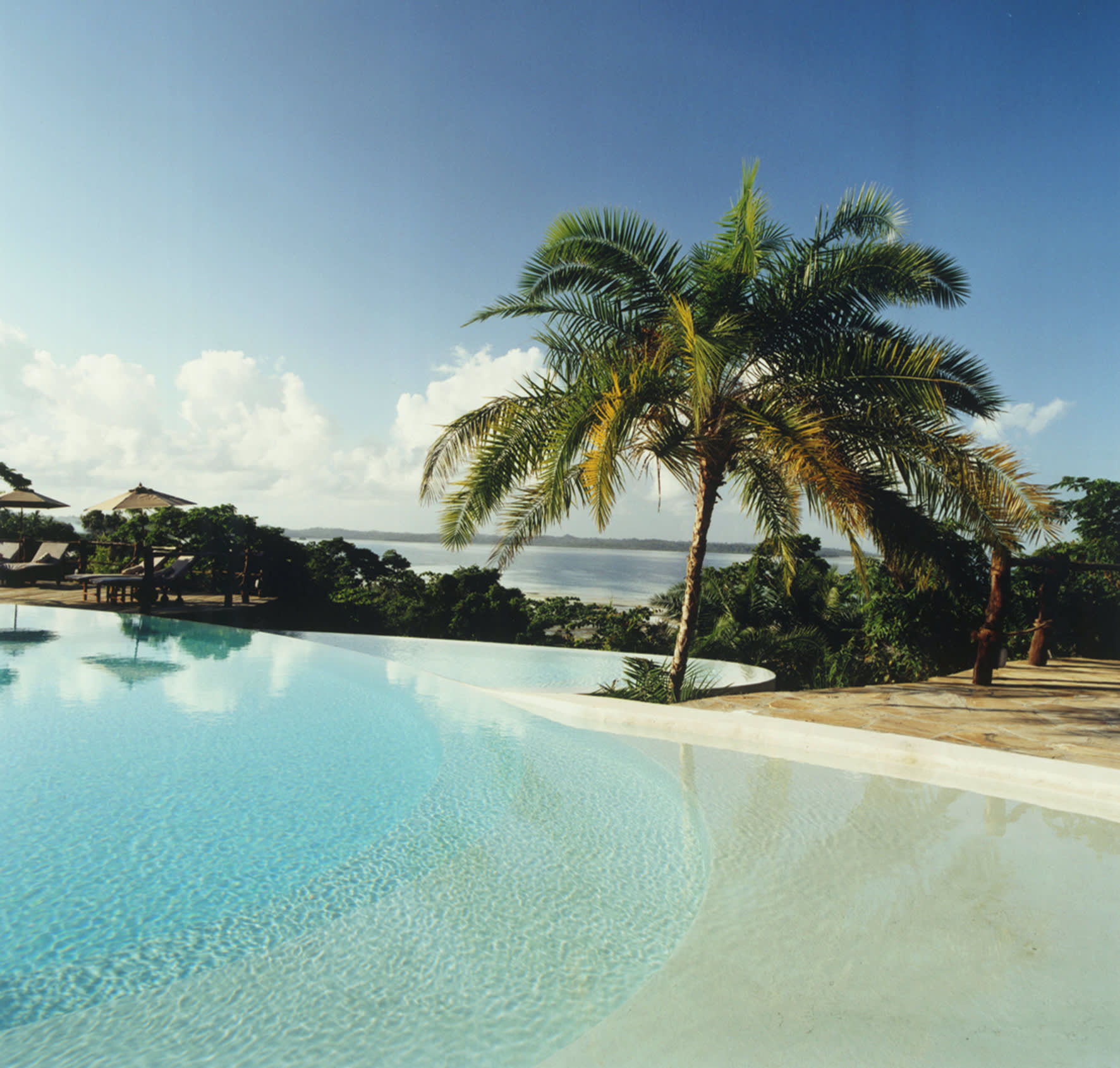a pool next to a body of water