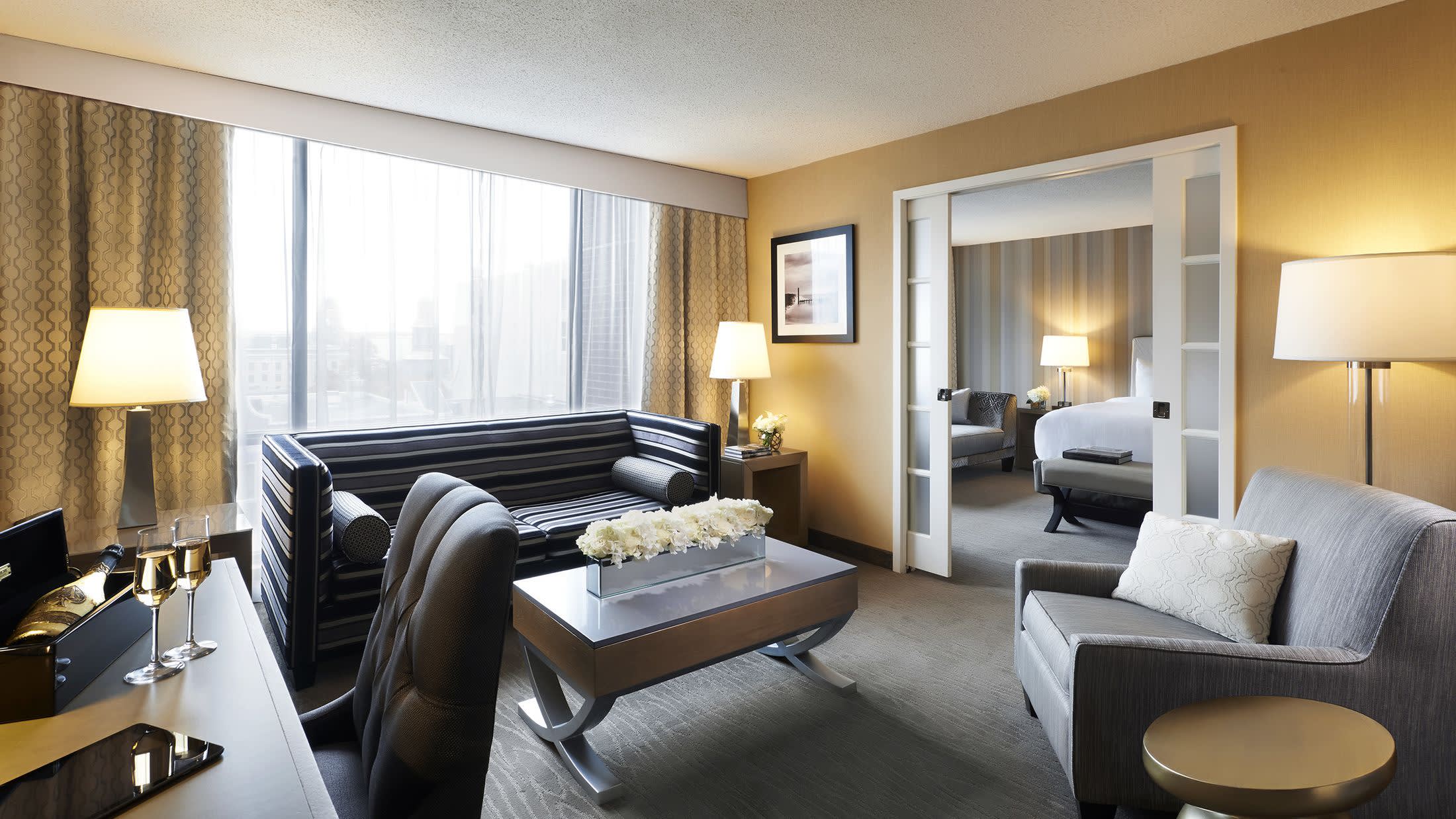 a living room filled with furniture and a large window