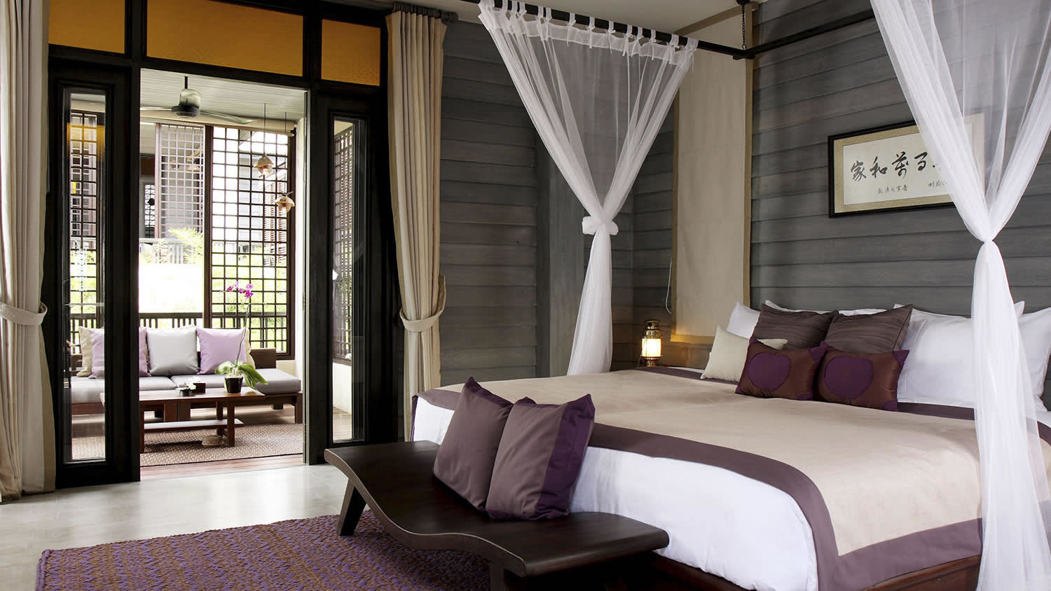 a bedroom with a large bed in a hotel room