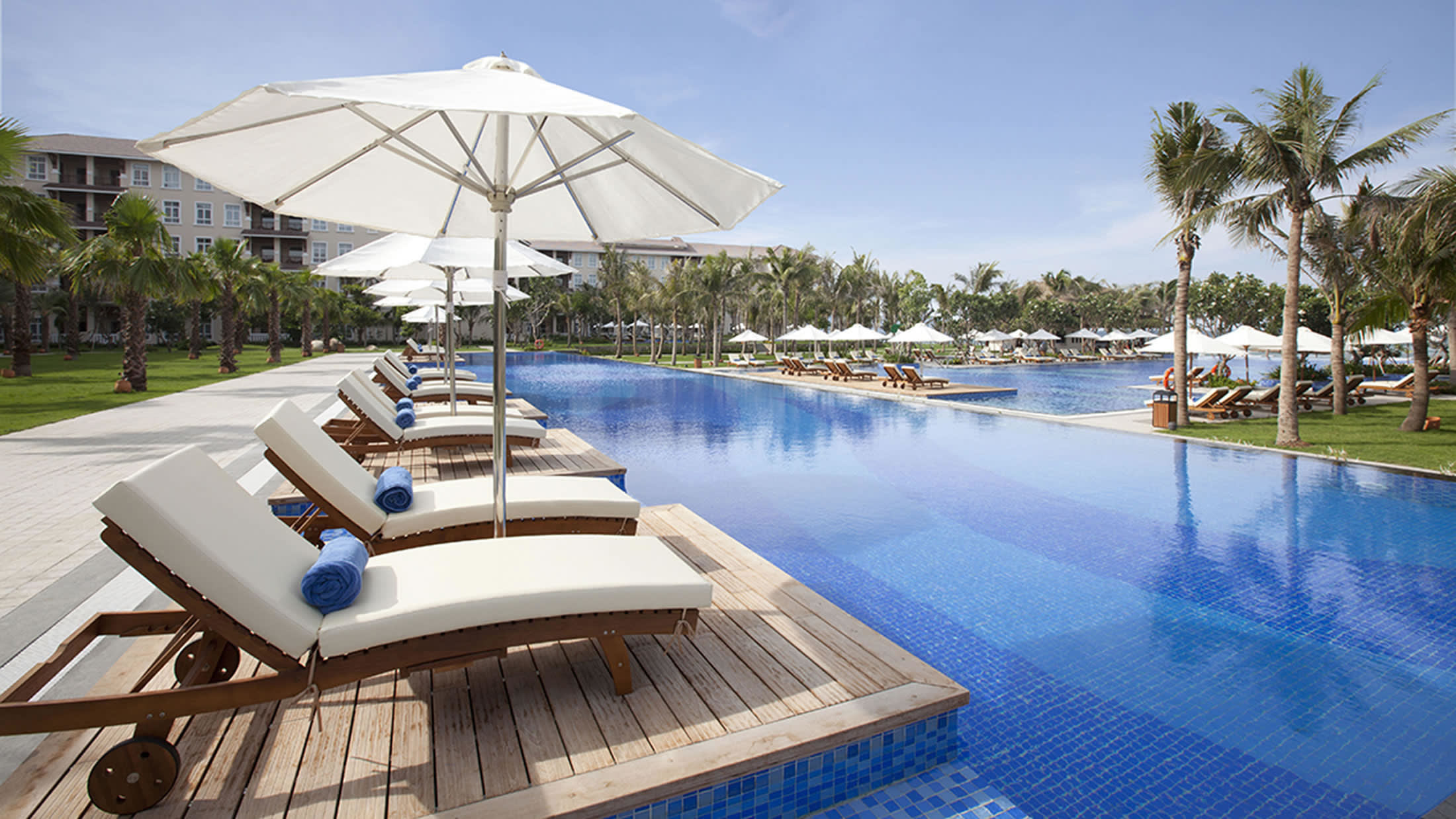 a boat sitting on top of a table next to a body of water