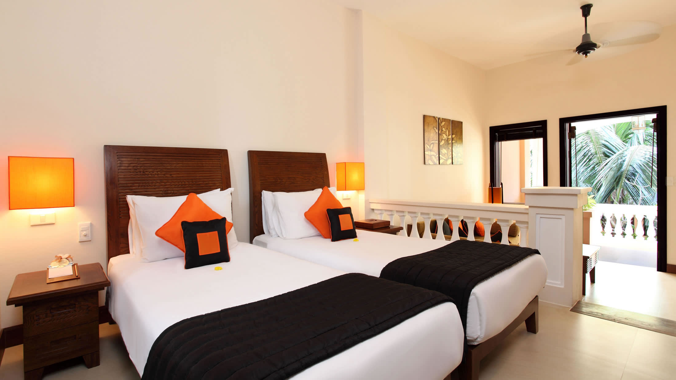 a bedroom with a bed and desk in a hotel room