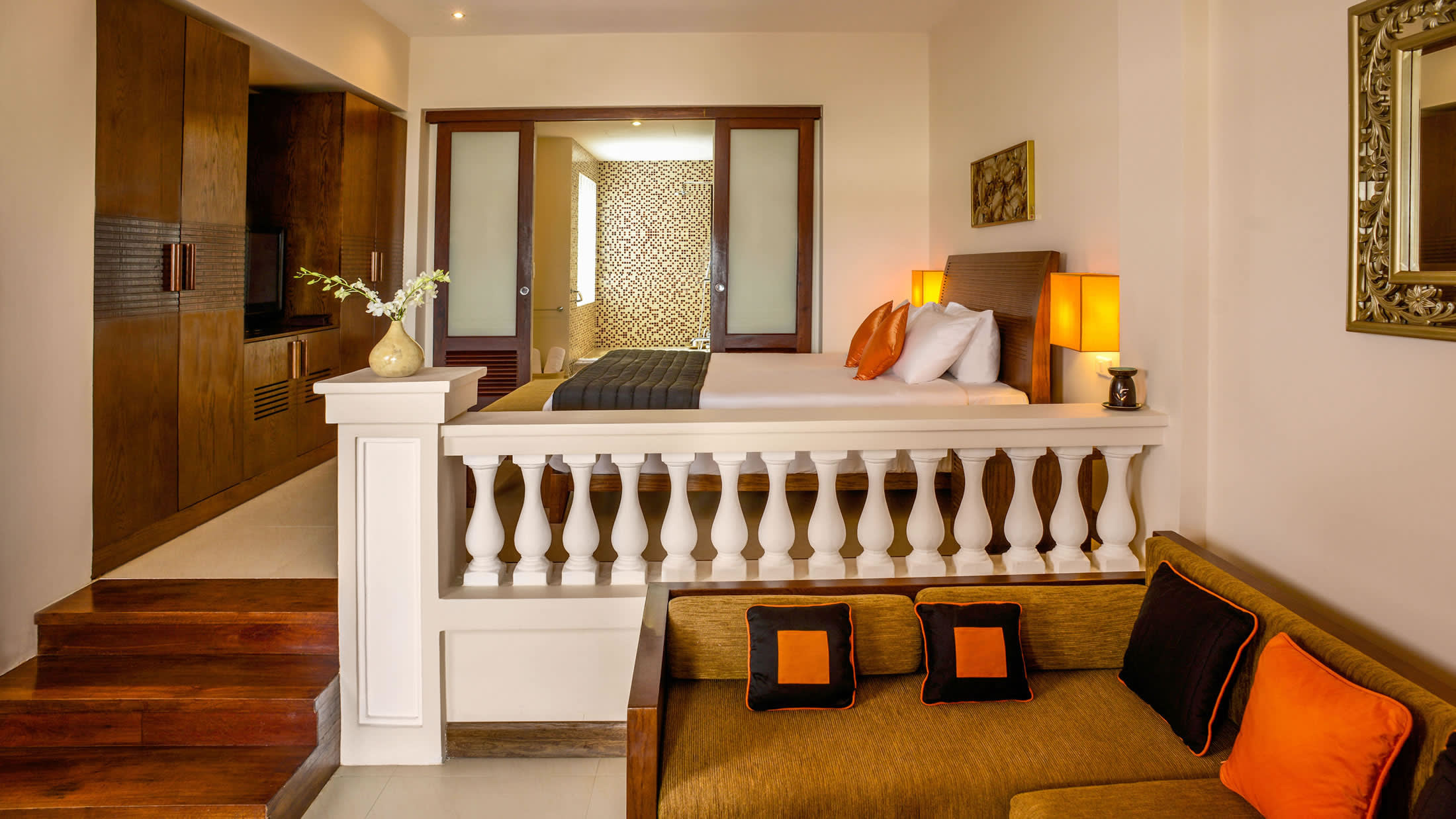 a bedroom with a large mirror