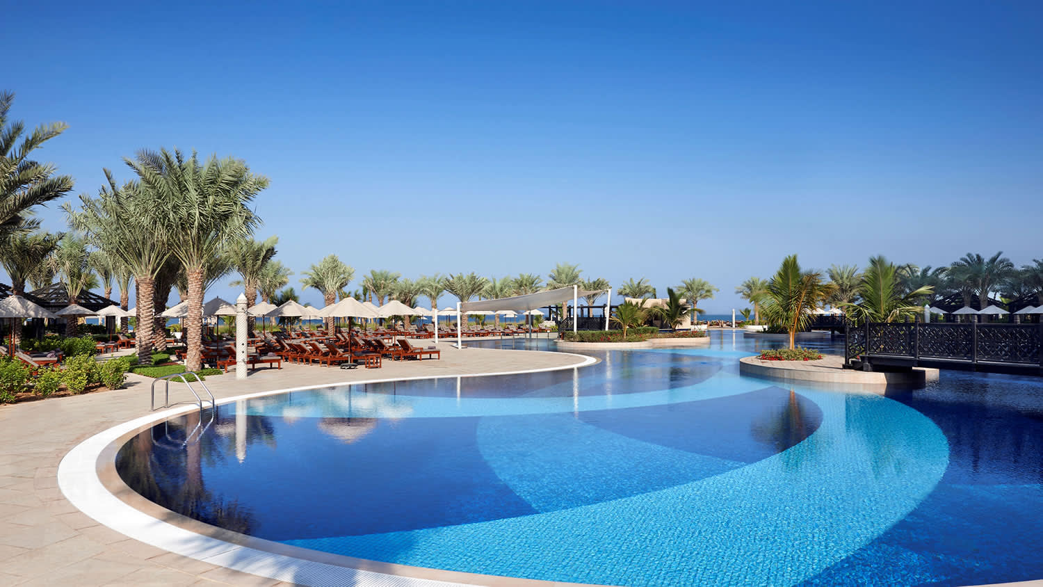 a pool next to a body of water