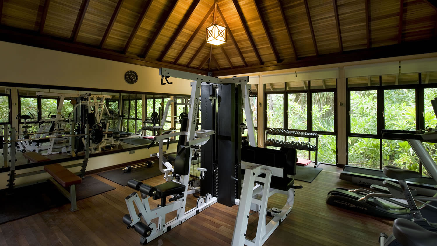 a living room filled with furniture and a large window