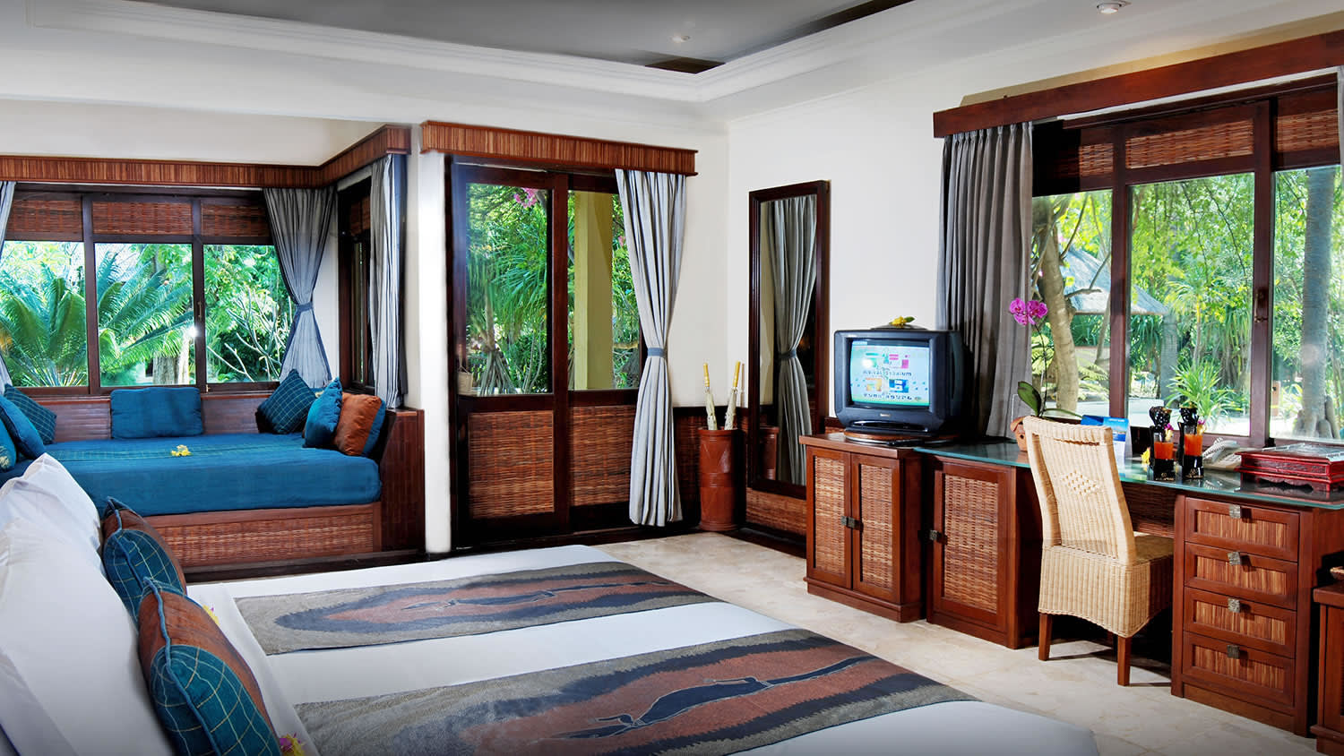 a living room with a bed and a window