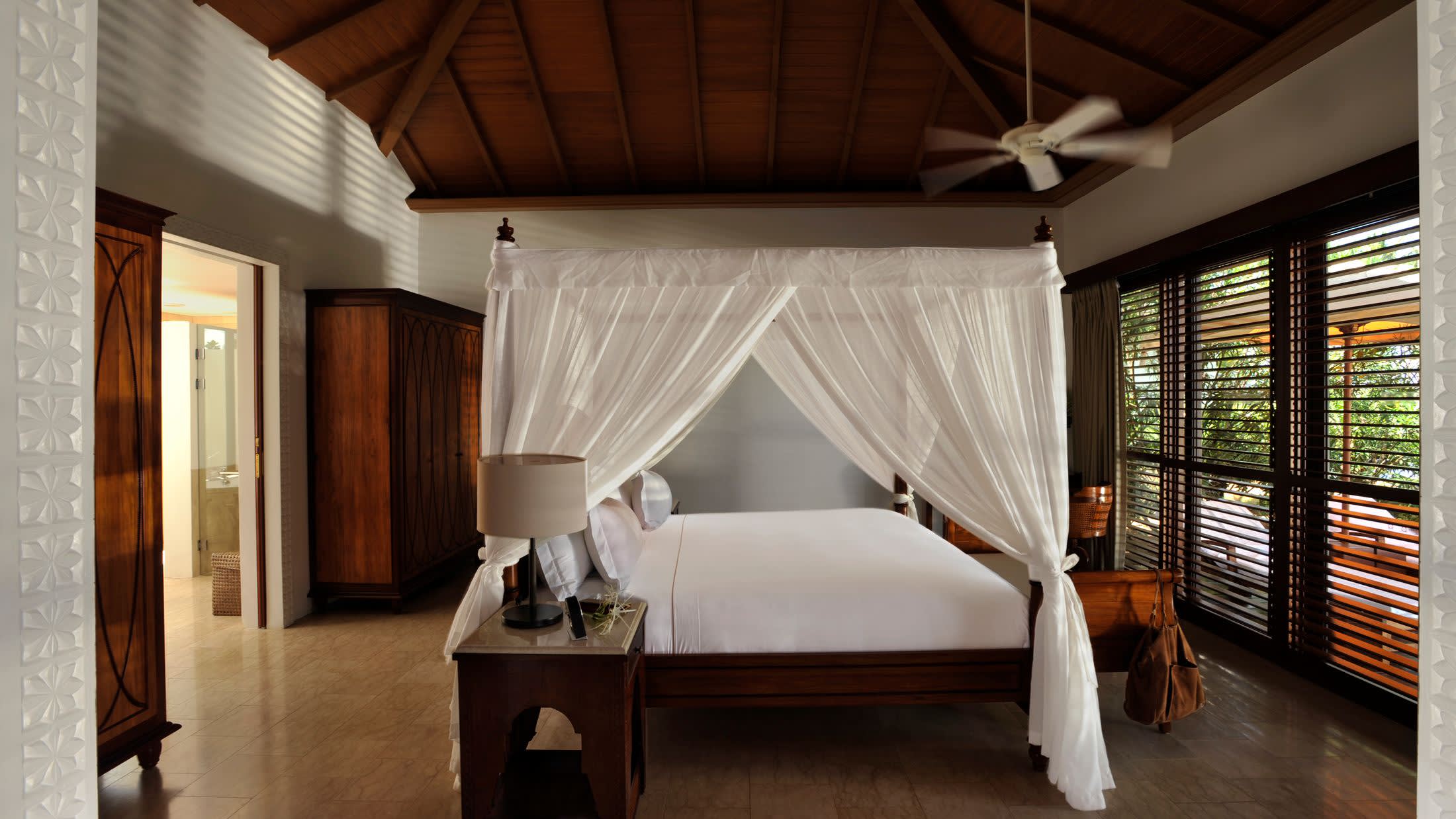 a living room filled with furniture and a large window