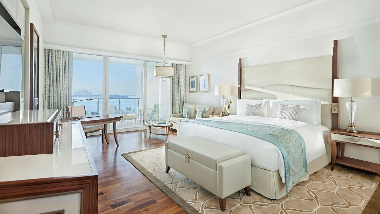 a bedroom with a bed and a chair in a room