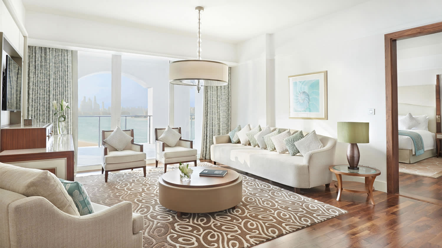 a living room filled with furniture and a large window