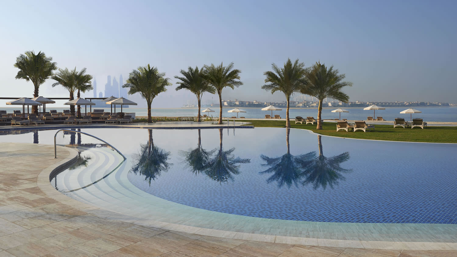 a pool next to a body of water