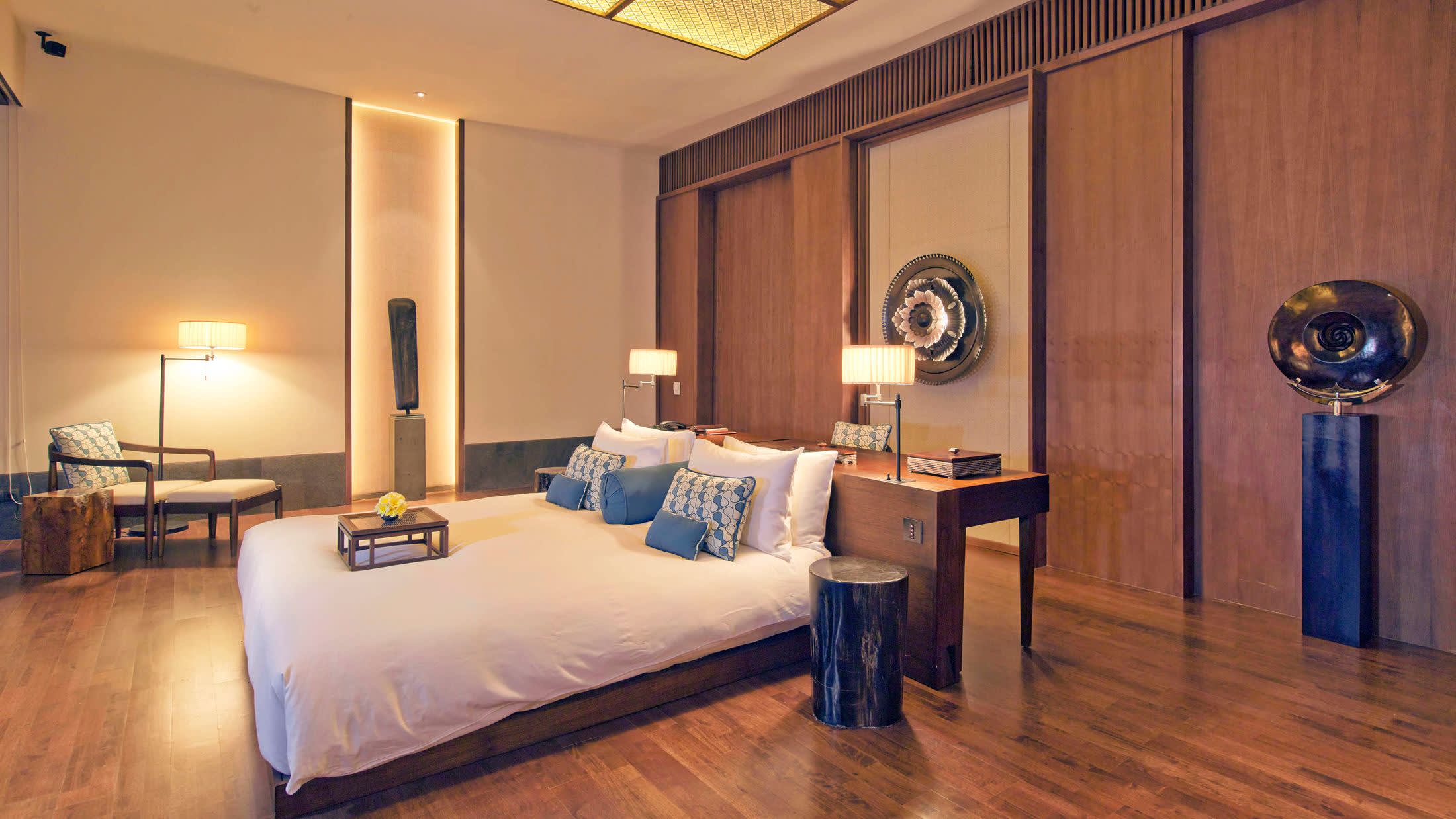 a bedroom with a view of a living room