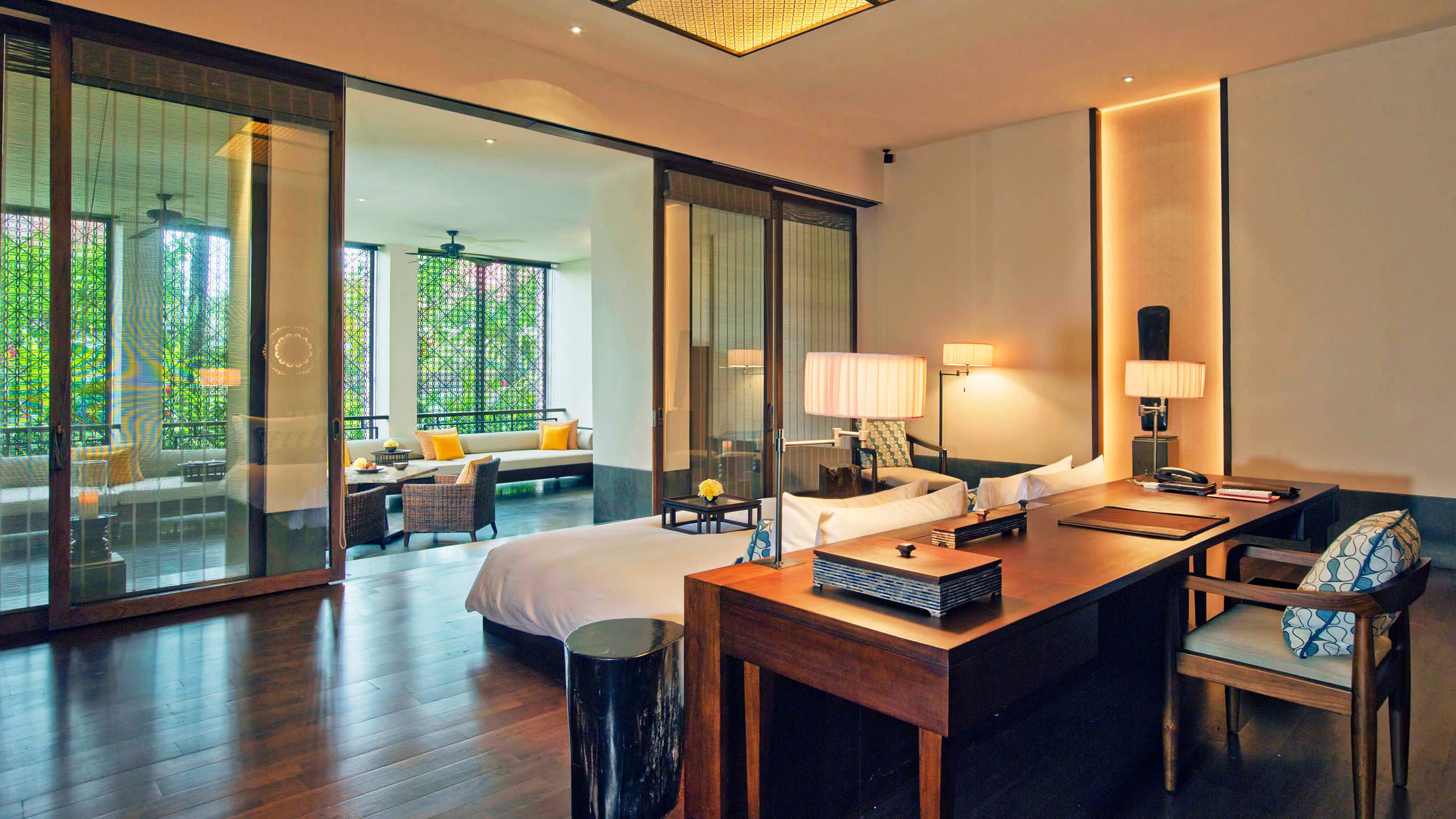 a room filled with furniture and a large window