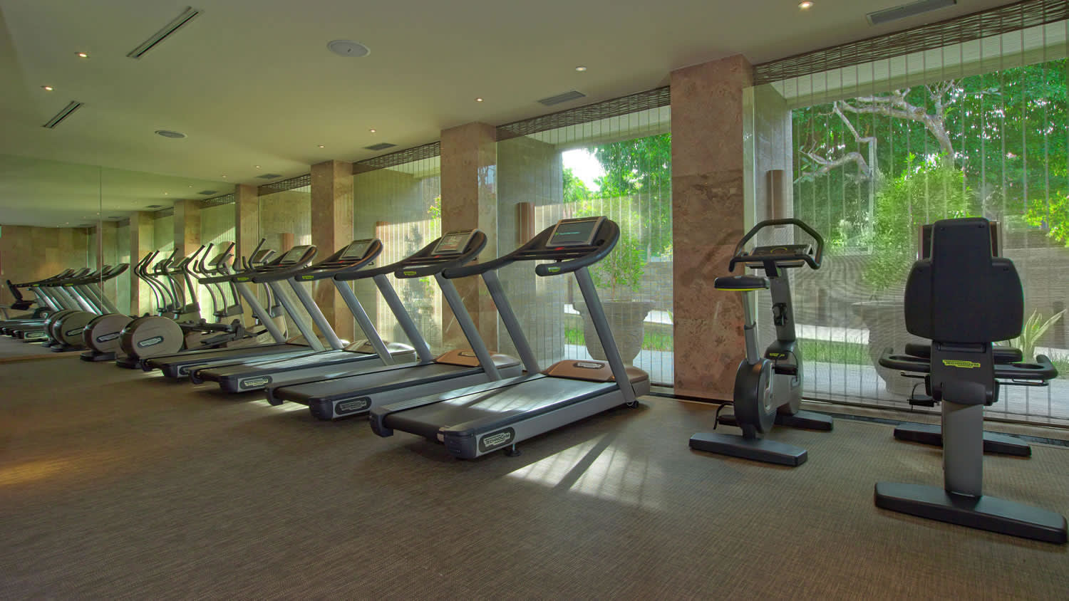 a room filled with furniture and a large window