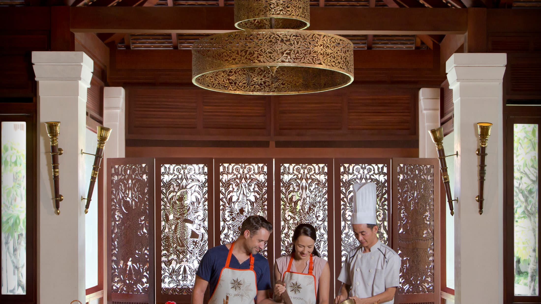 a man and a woman standing in front of a window