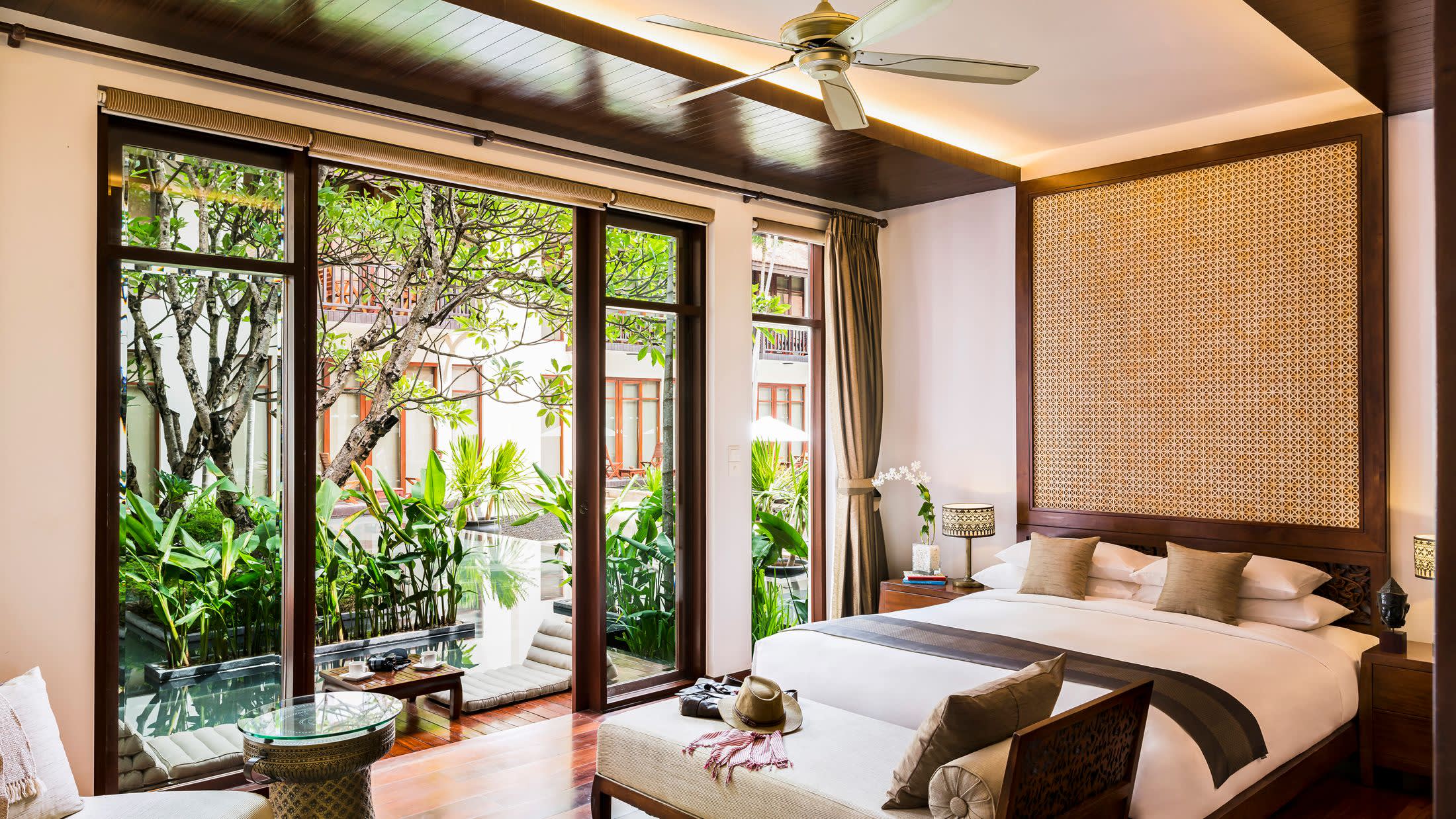 a living room filled with furniture and a large window