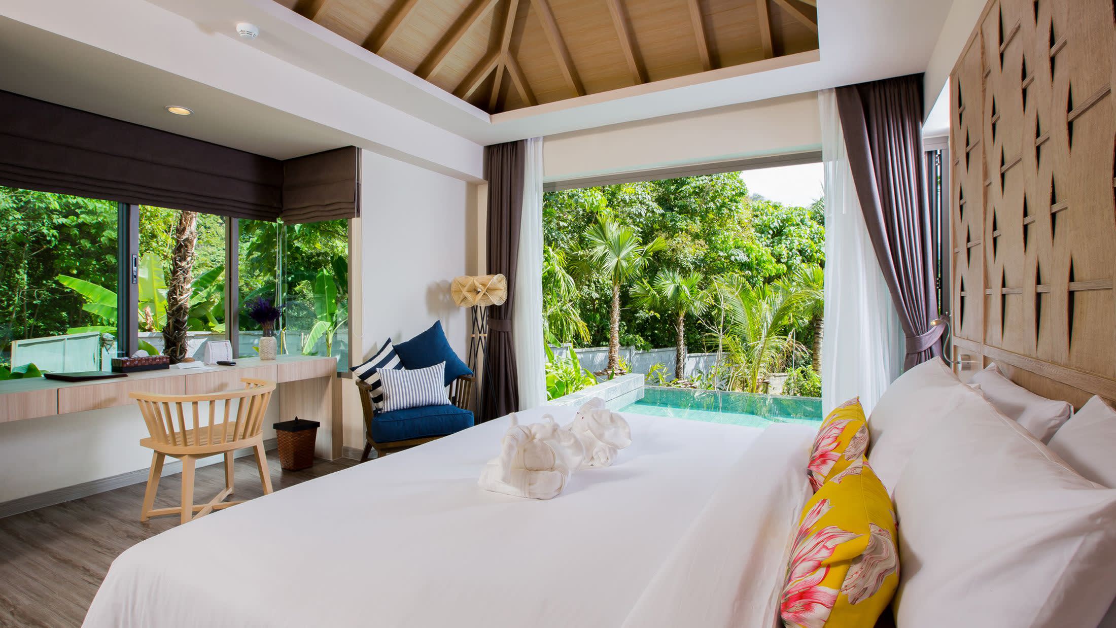 a hotel room with a bed and a window