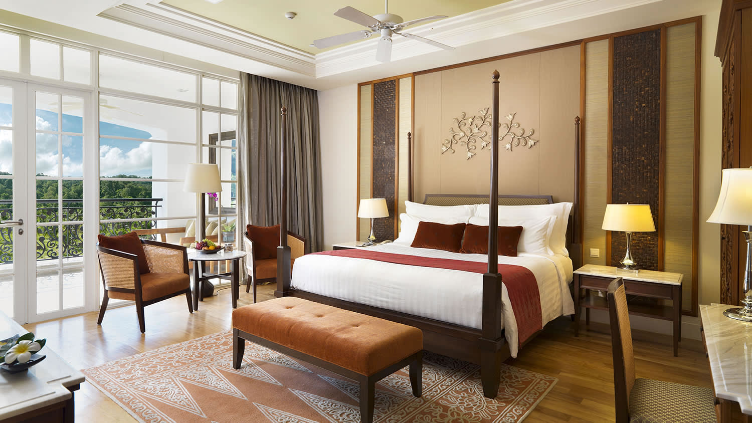 a hotel room filled with furniture and a large window