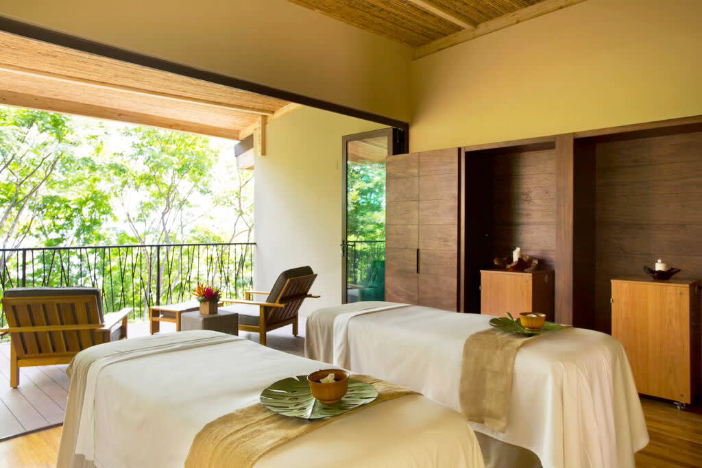 a bedroom with a large window