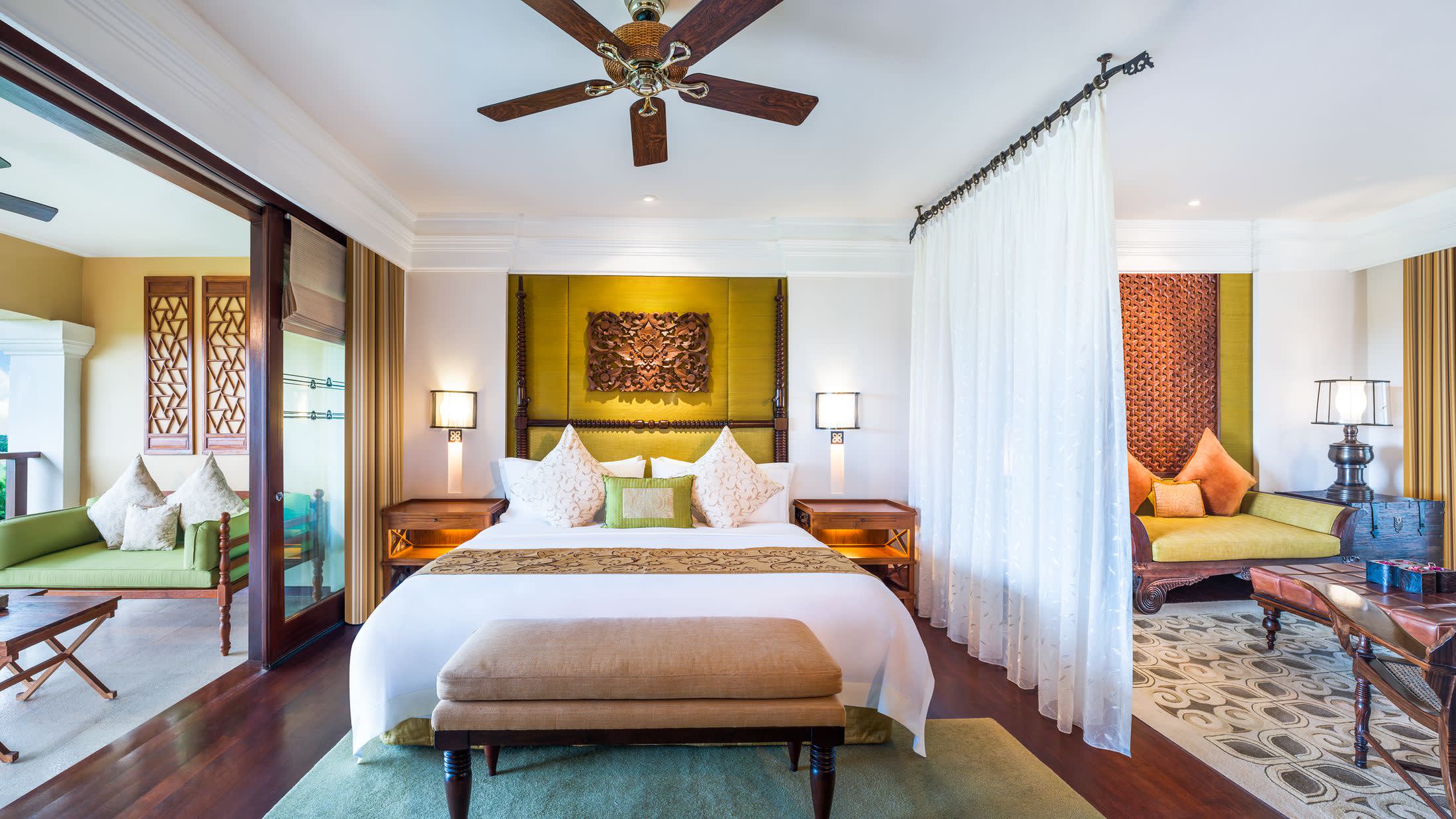 a living room filled with furniture and a large window