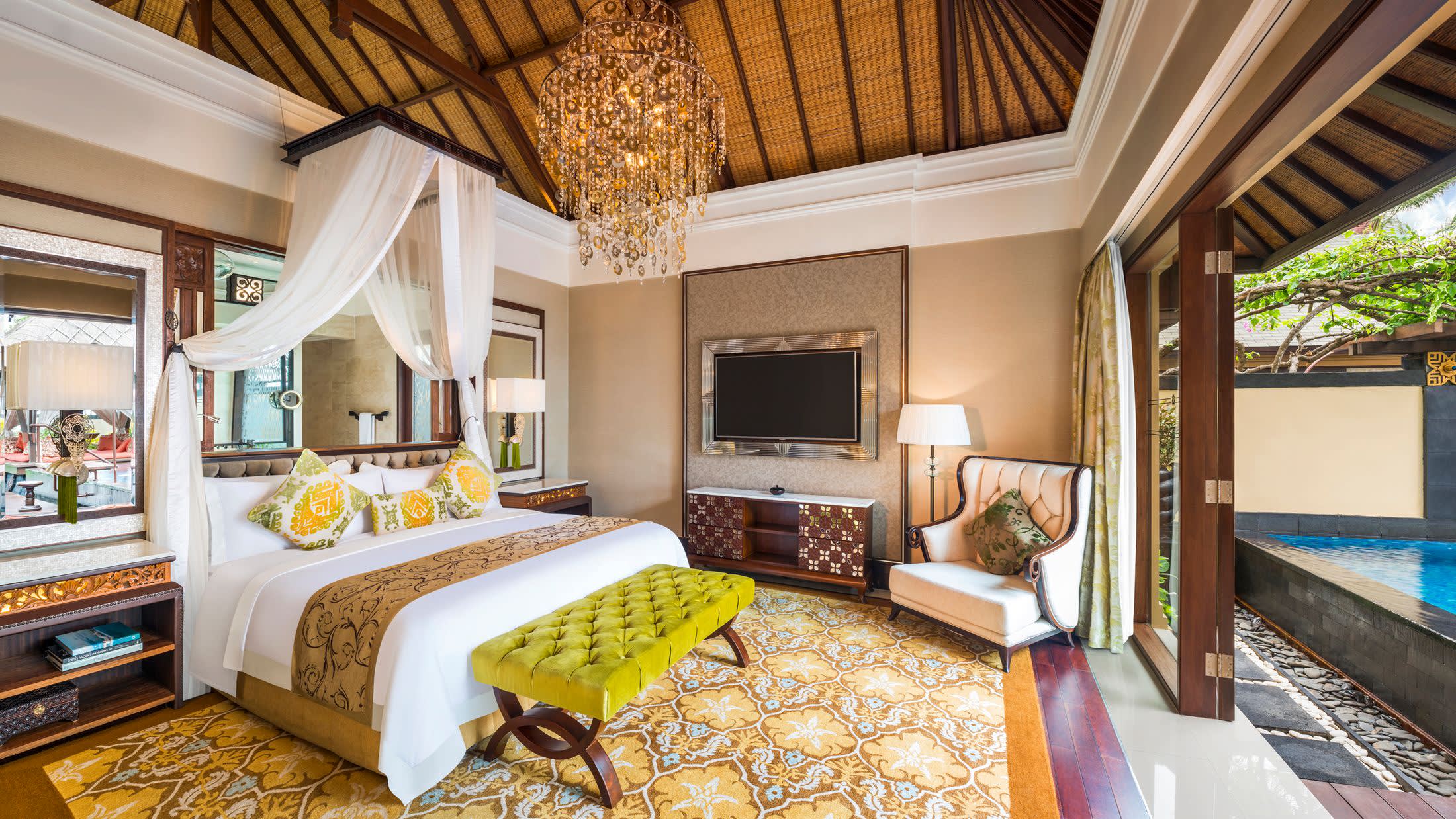 a living room filled with furniture and a bed