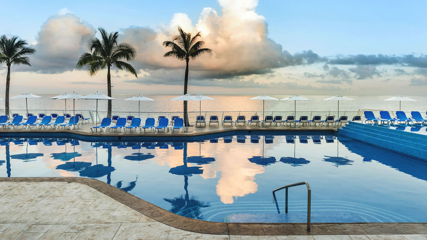 a pool next to a body of water