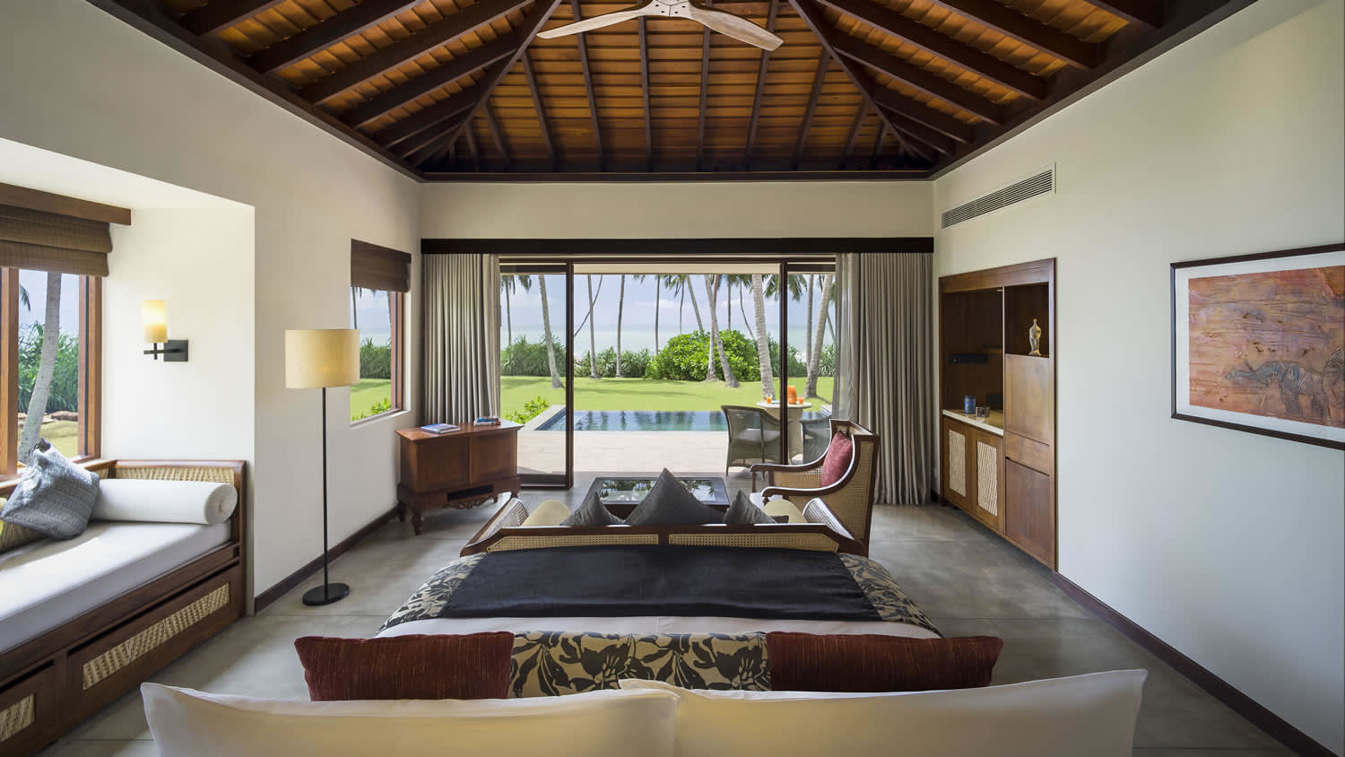 a living room filled with furniture and a large window