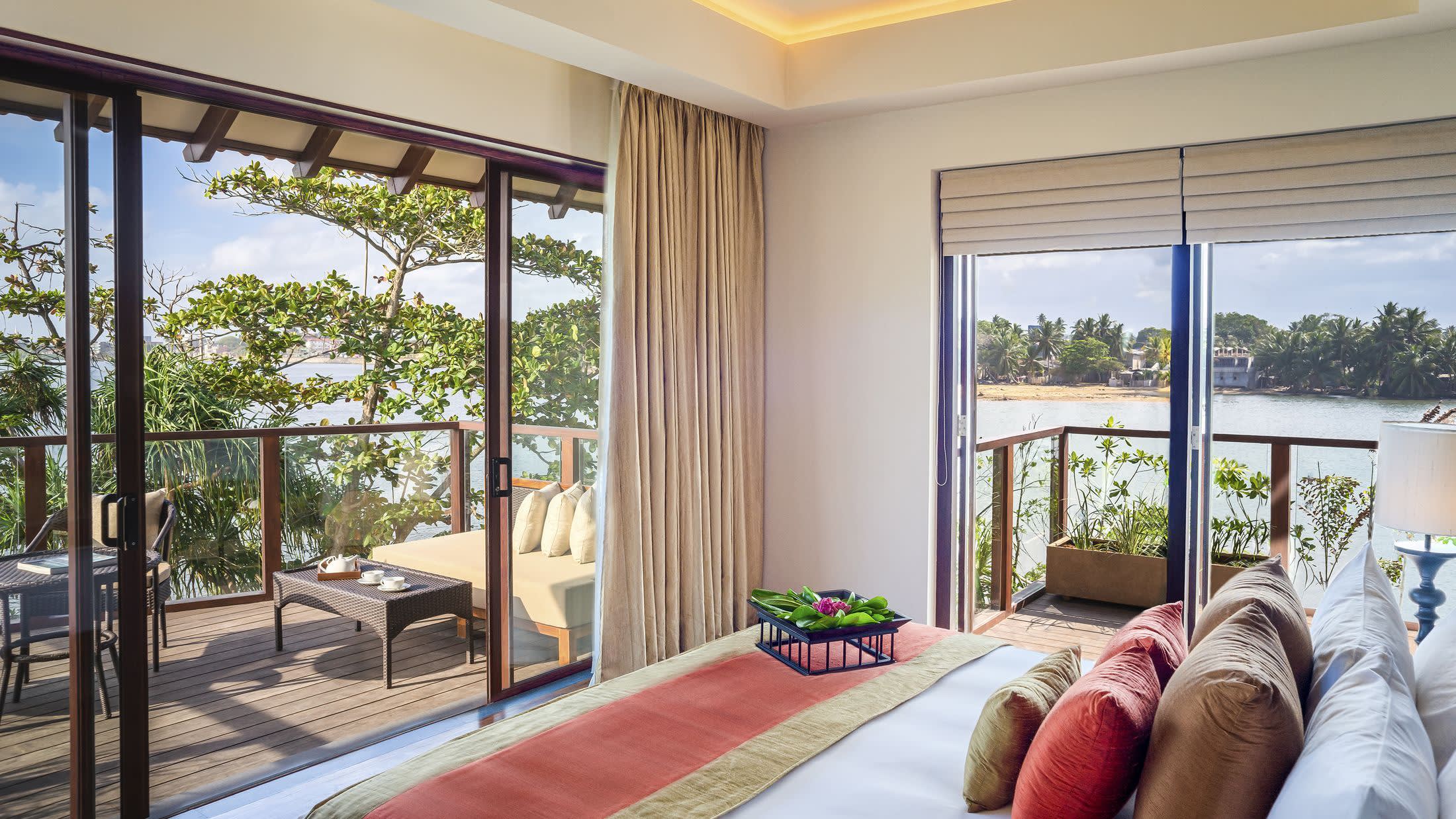 a living room filled with furniture and a large window